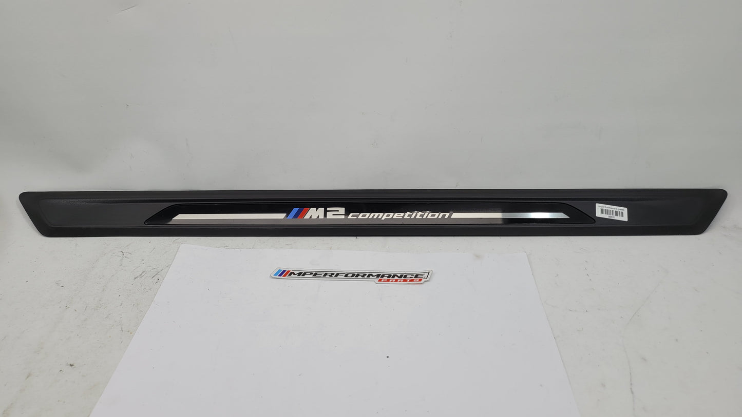 BMW M2 Competition F87 door sill scuff plate, left or right, black with MPerformance.parts branding, installed on vehicle.