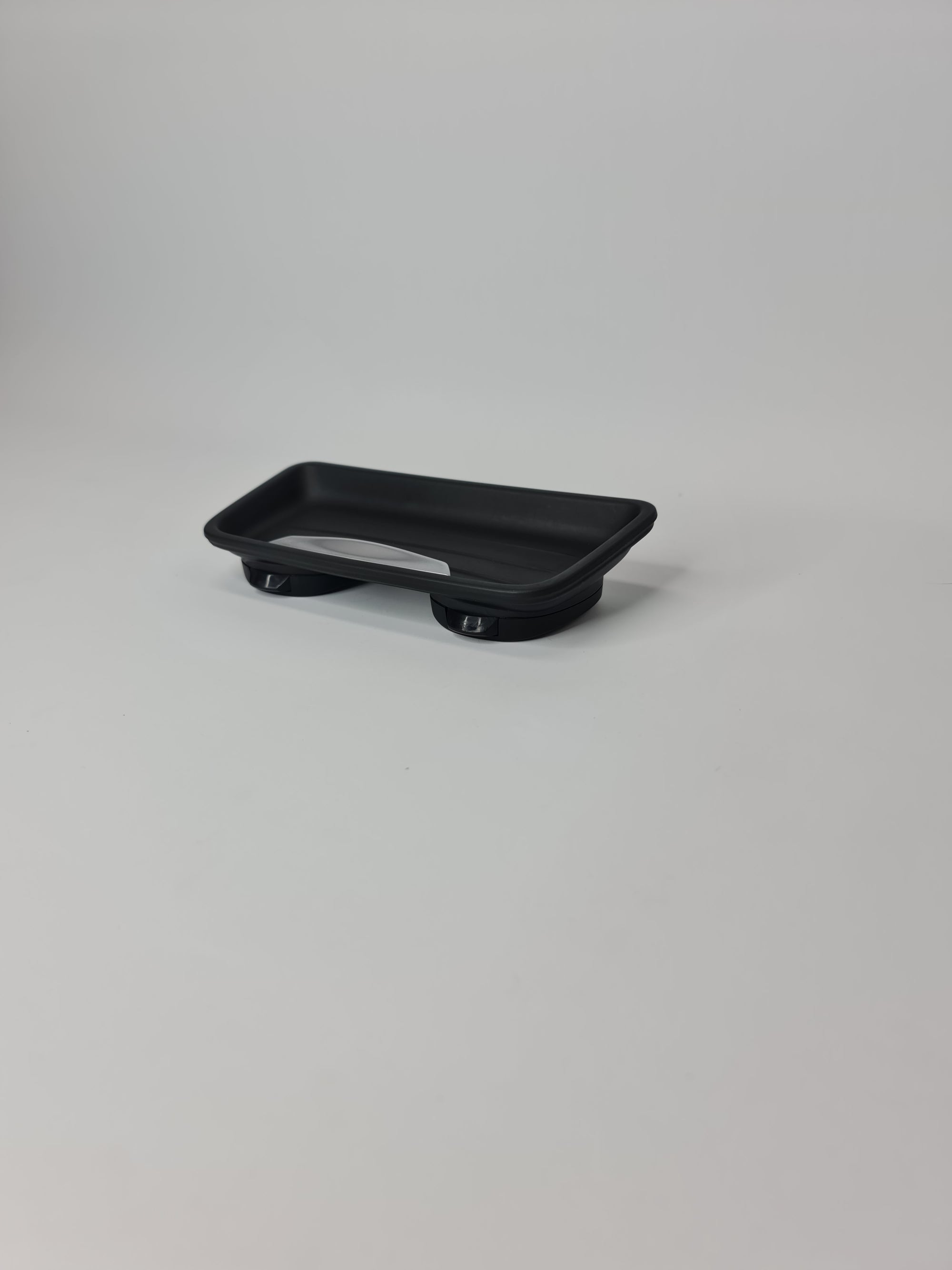 BMW oddments tray cup holder insert with multiple compartments for vehicle interior storage.