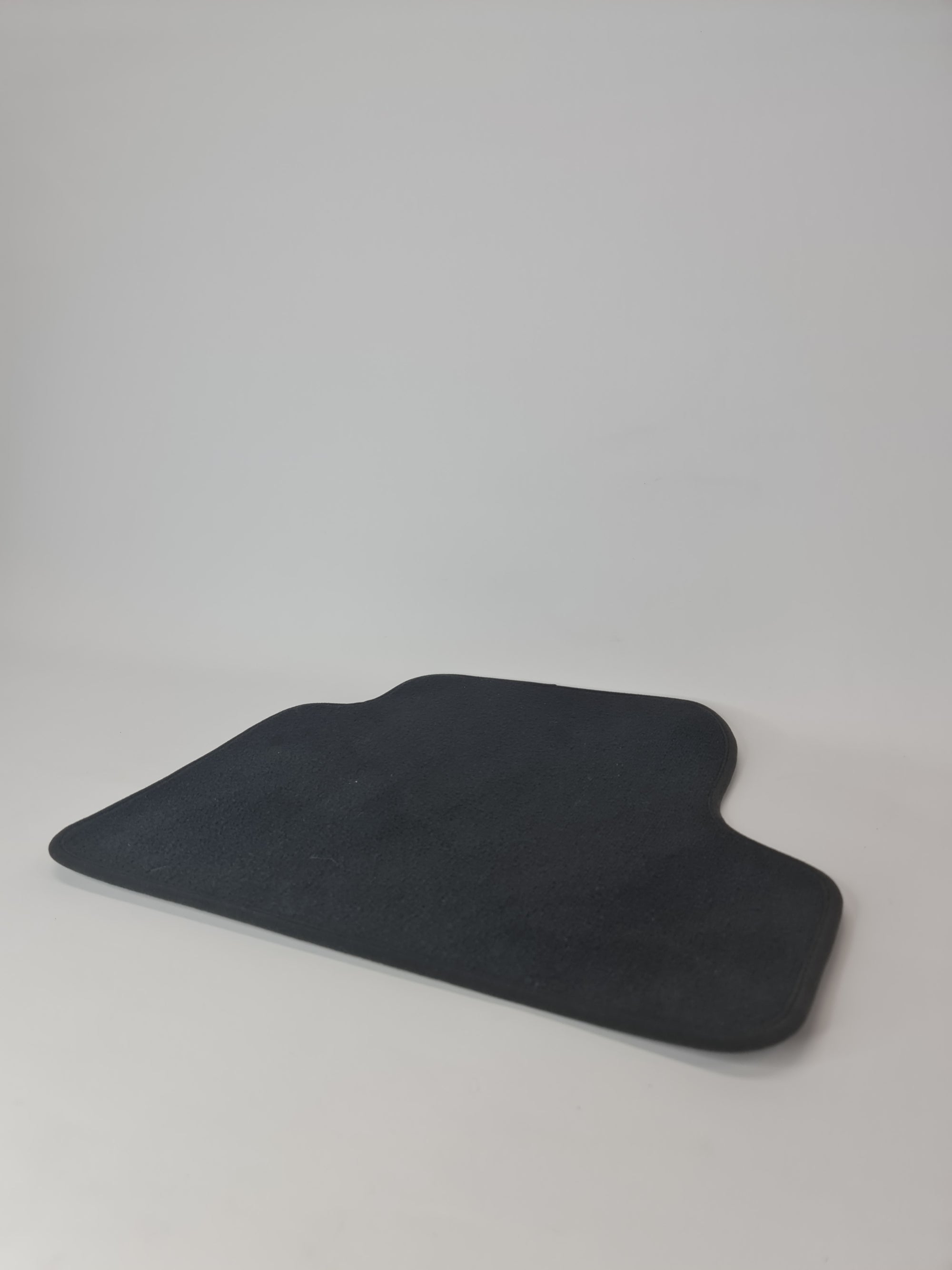 BMW F87 M2 rear right floor mat with black textured surface and custom fit, designed for MPerformance.parts BMW model.
