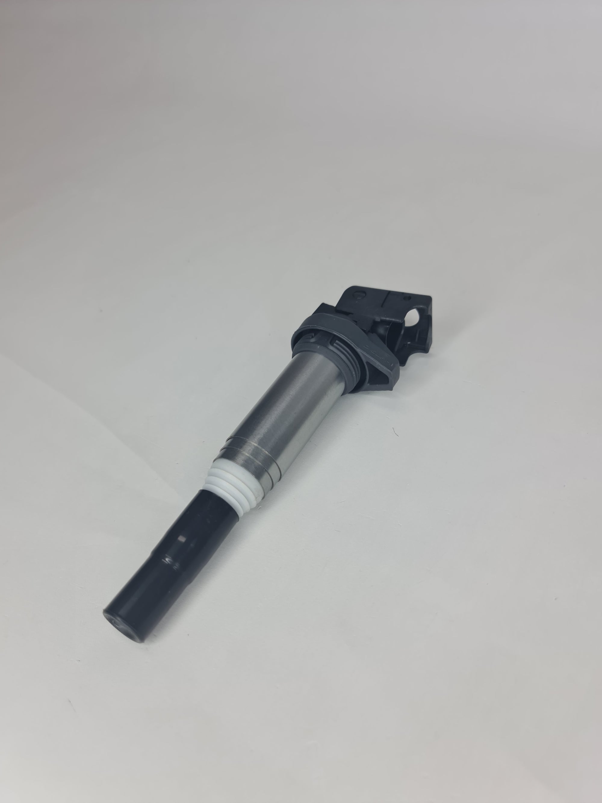 BMW ignition coil for 2001-2020 12-13-8-616-153 model, close-up of the black coil with electrical connectors.