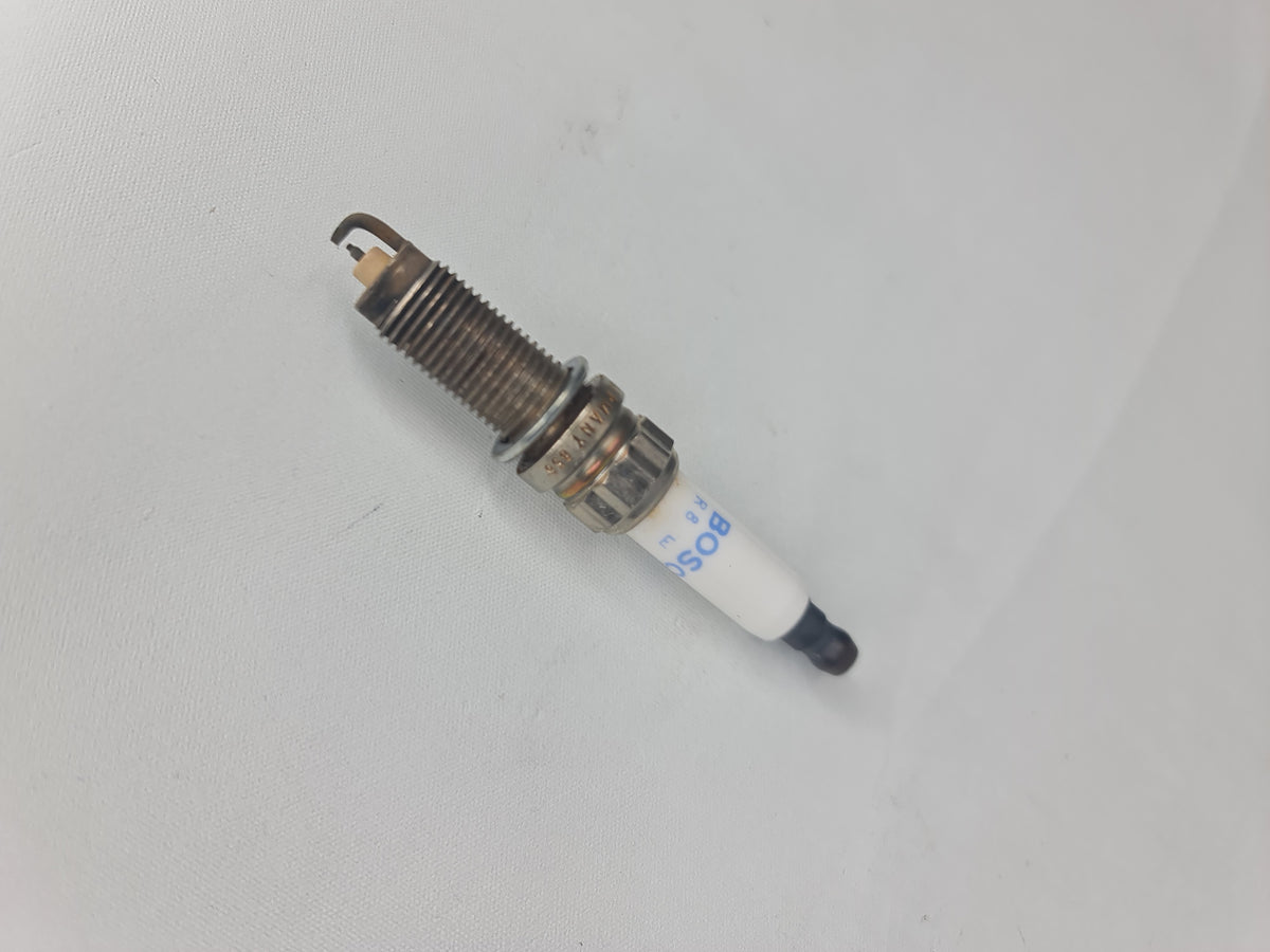 BMW 2012-2016 high power spark plug 12-12-0-038-832, showing the metal and ceramic components of the ignition part.