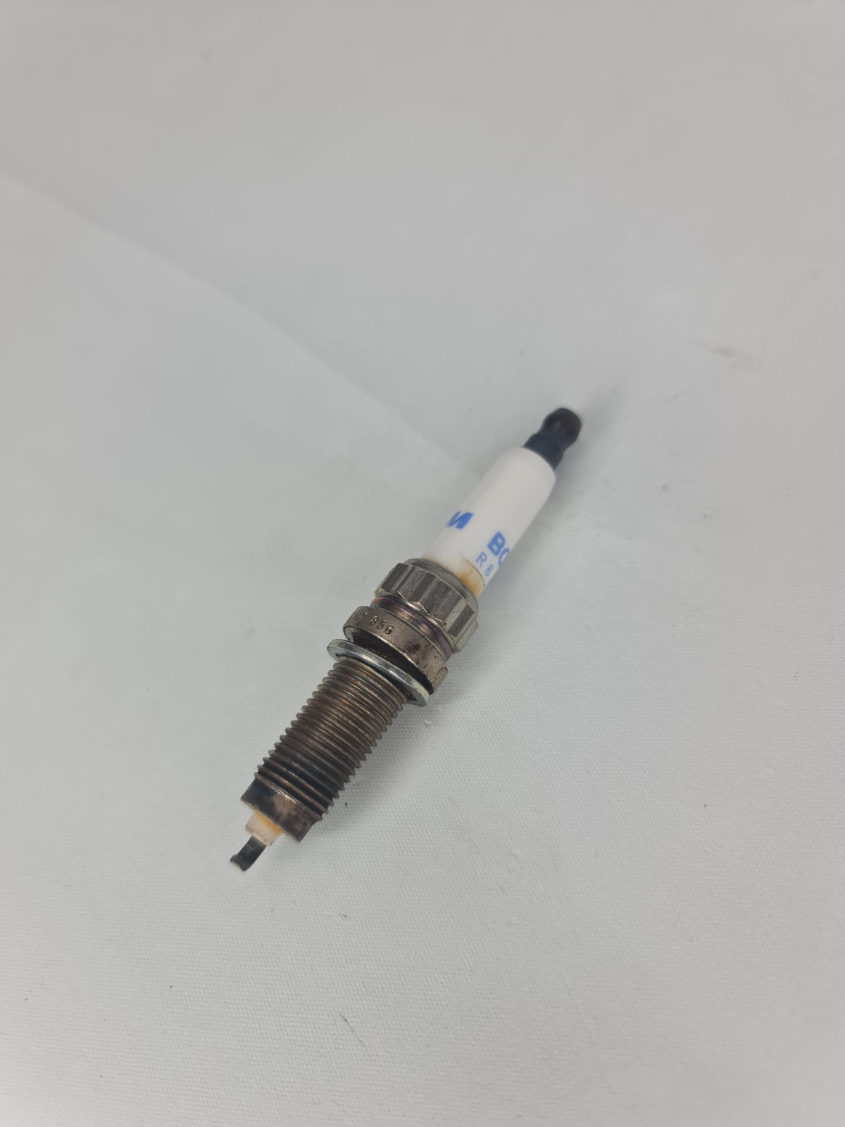 BMW high power spark plug 2012-2016 12-12-0-038-832 for optimal engine performance, shown in the image.