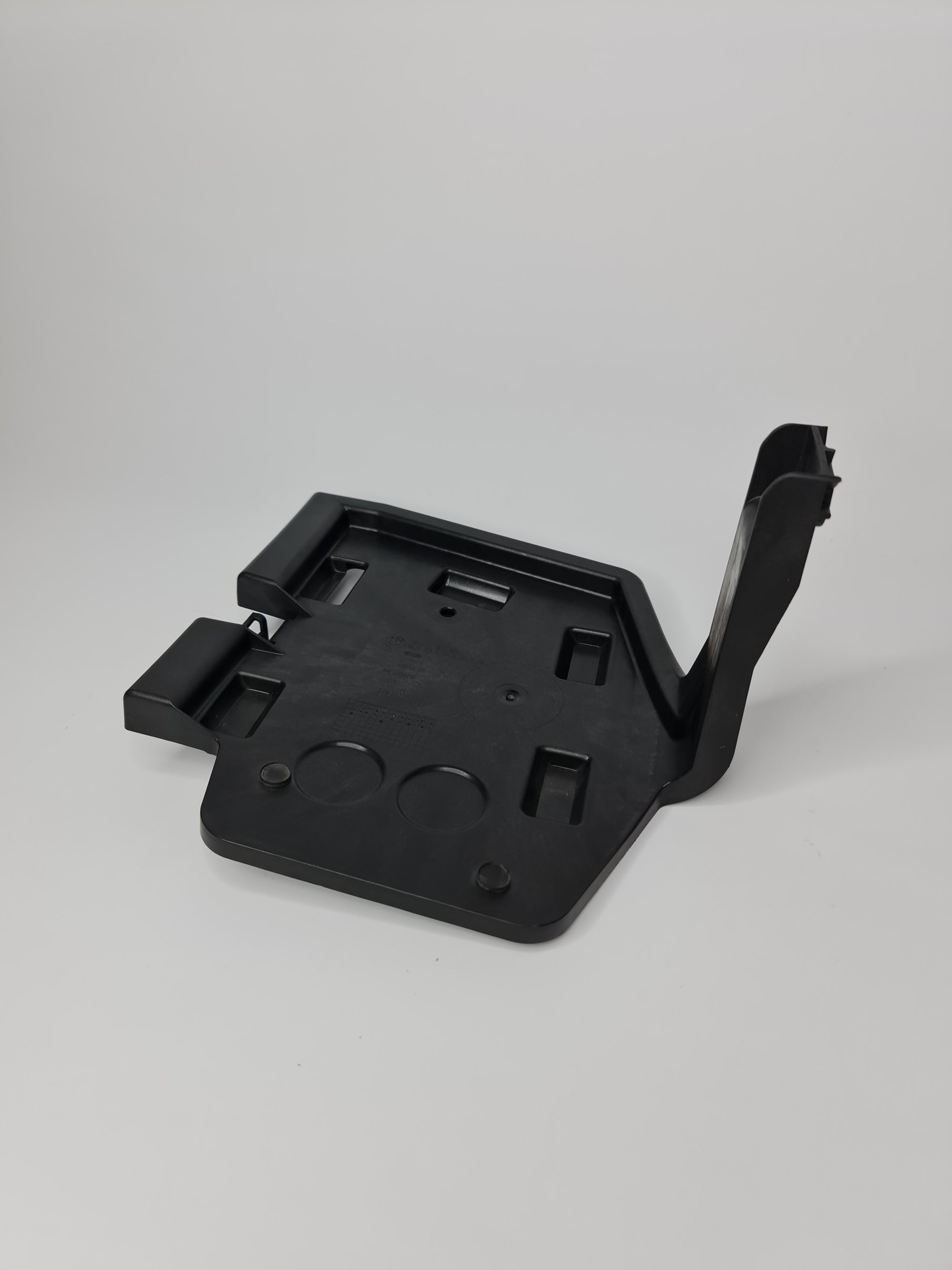 BMW 328i F30 rear left trunk lid tailgate trim bracket, OEM part 51477295817, close-up view showing mounting details.