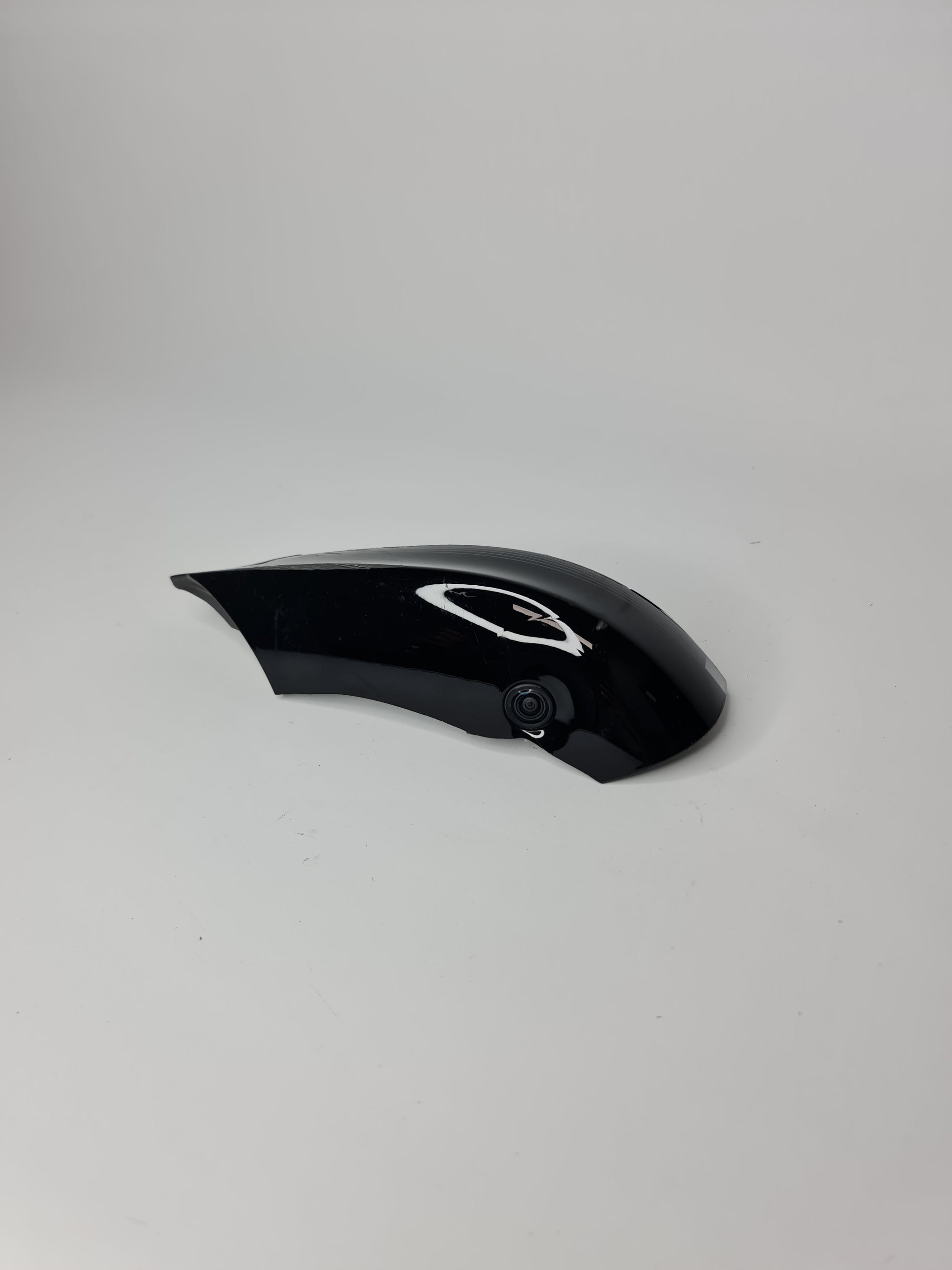 BMW F80 left door mirror camera by MPerformance.parts, showing the camera lens and housing on the vehicle door.