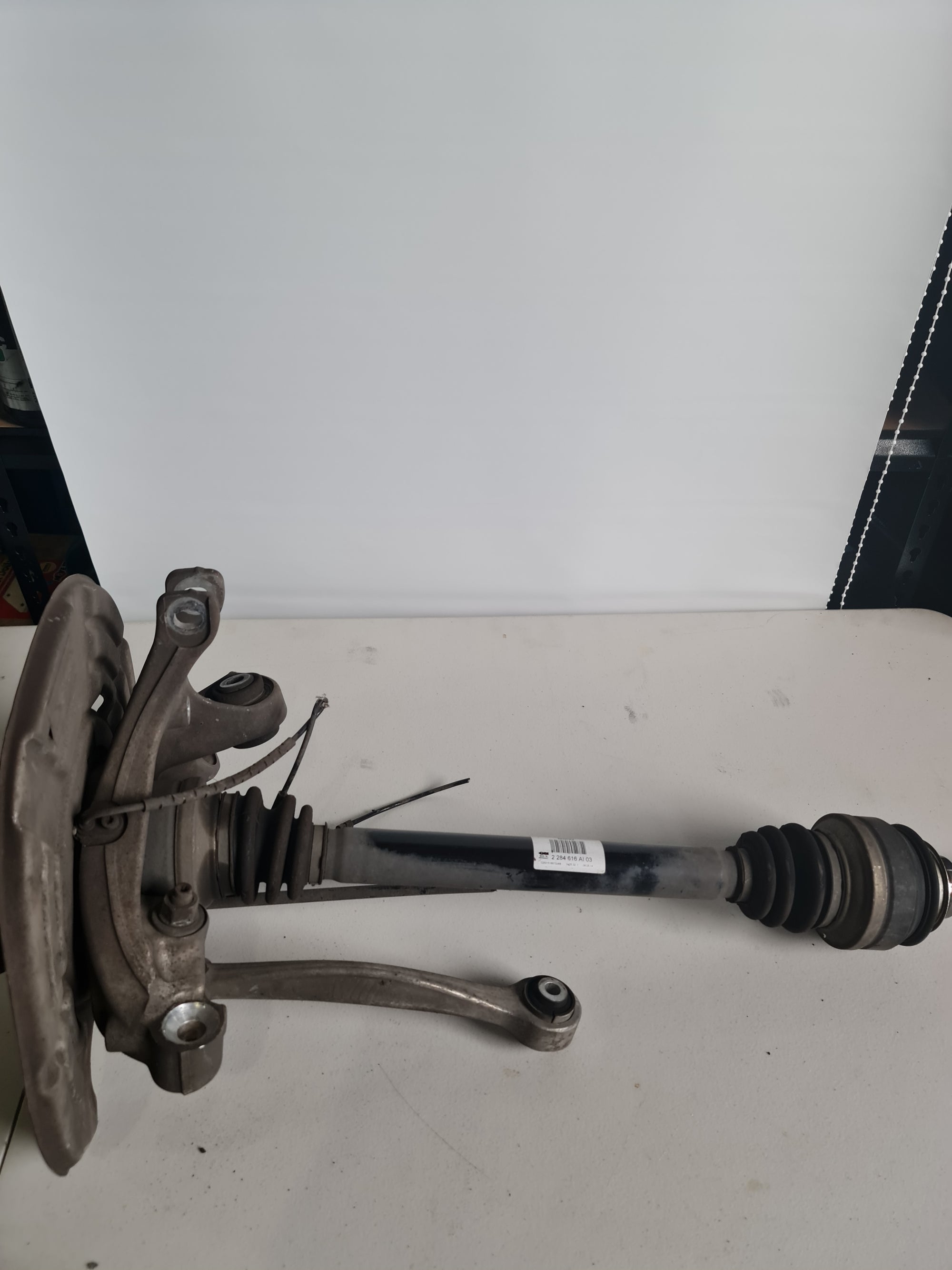 BMW OEM F87 F80 F82 M3 M4 M2 rear right axle assembly with knuckle and hub, part number 2284616, for vehicle drivetrain repair.
