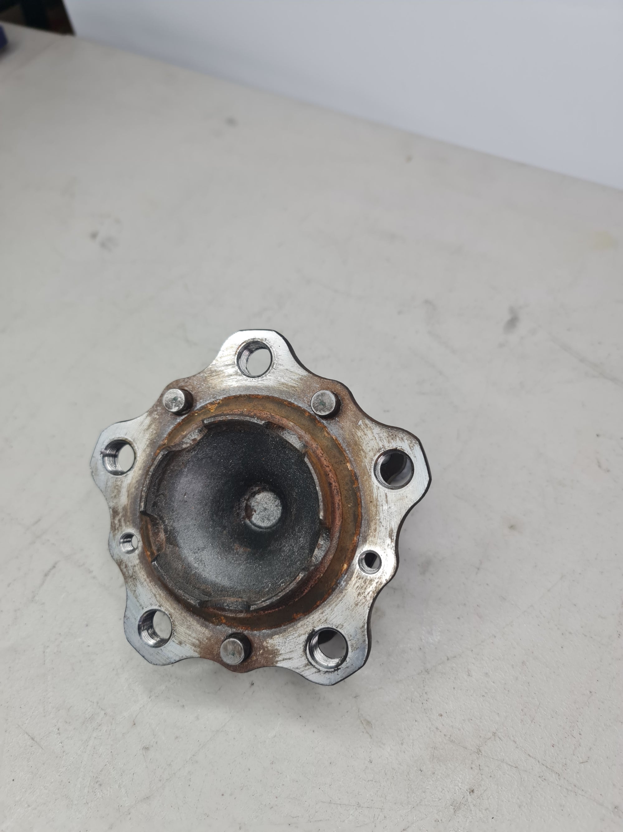 BMW front wheel hub with bearing, model 2015-2020, showing the metallic hub and bearing assembly with mounting details.