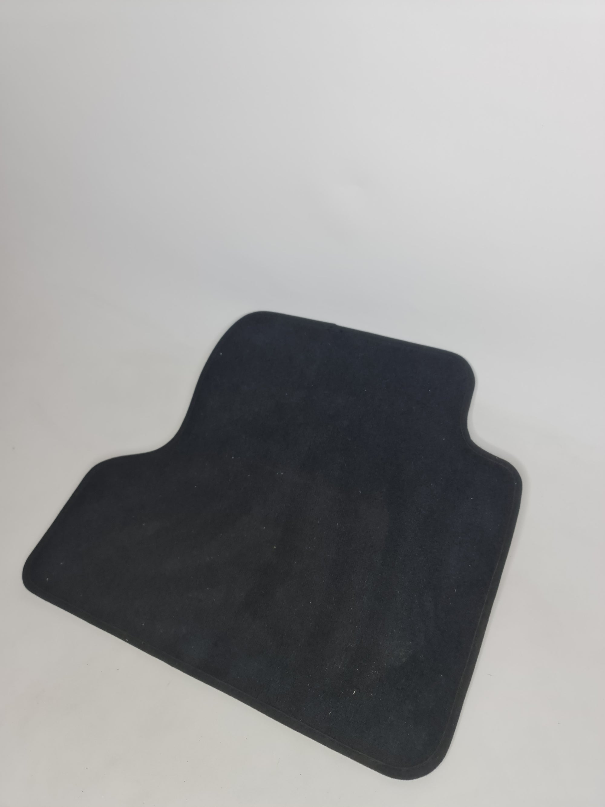 F82 M4 rear right floor mat by MPerformance.parts, black rubber car mat with textured surface for interior protection.