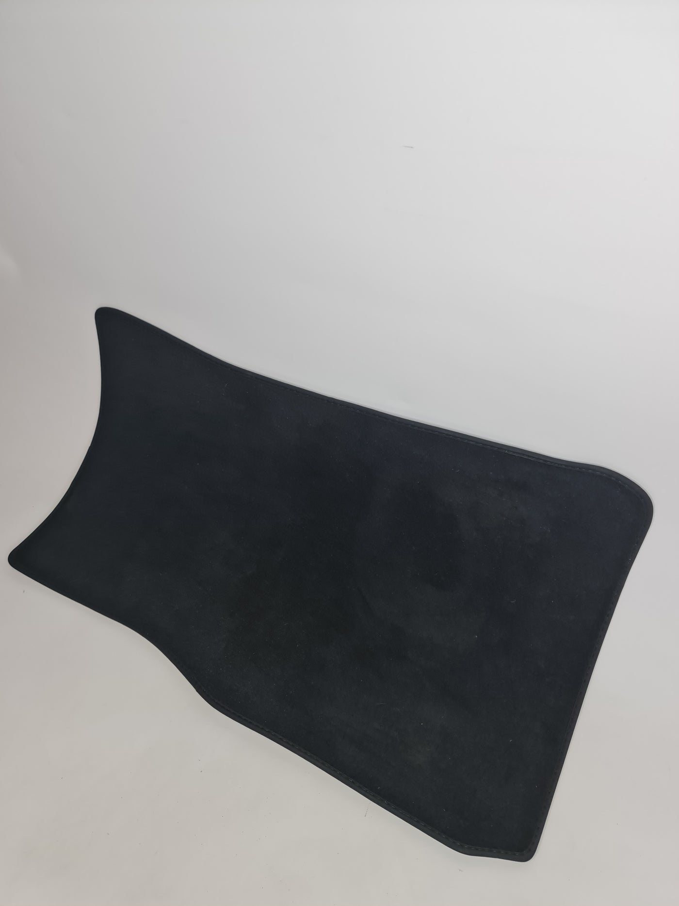 Black F80 M3 passenger floor mat by MPerformance.parts showing textured rubber surface and custom fit for interior protection.