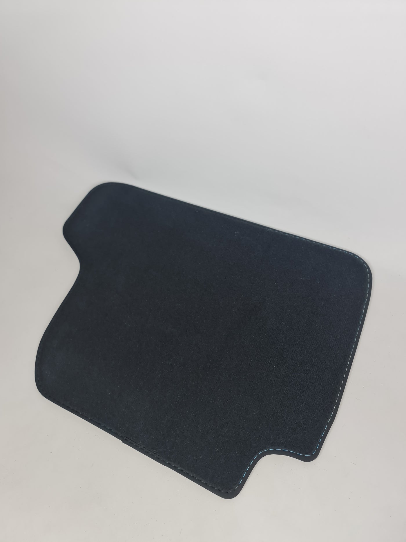 F82 M4 rear left floor mat by MPerformance.parts, black rubber mat with textured surface for vehicle interior protection.