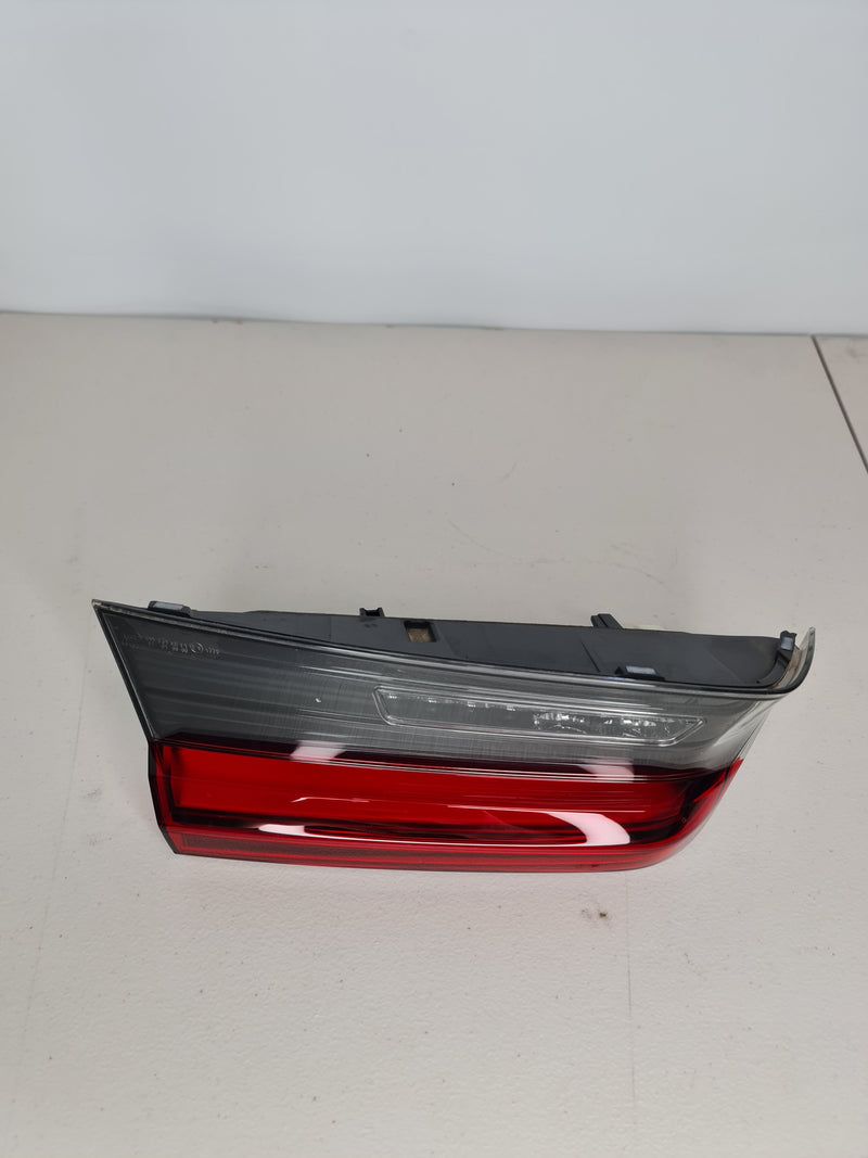 BMW M3 G80 left LED inner trunk lid taillight OEM, showing the sleek design and LED lighting elements on the tail light assembly.