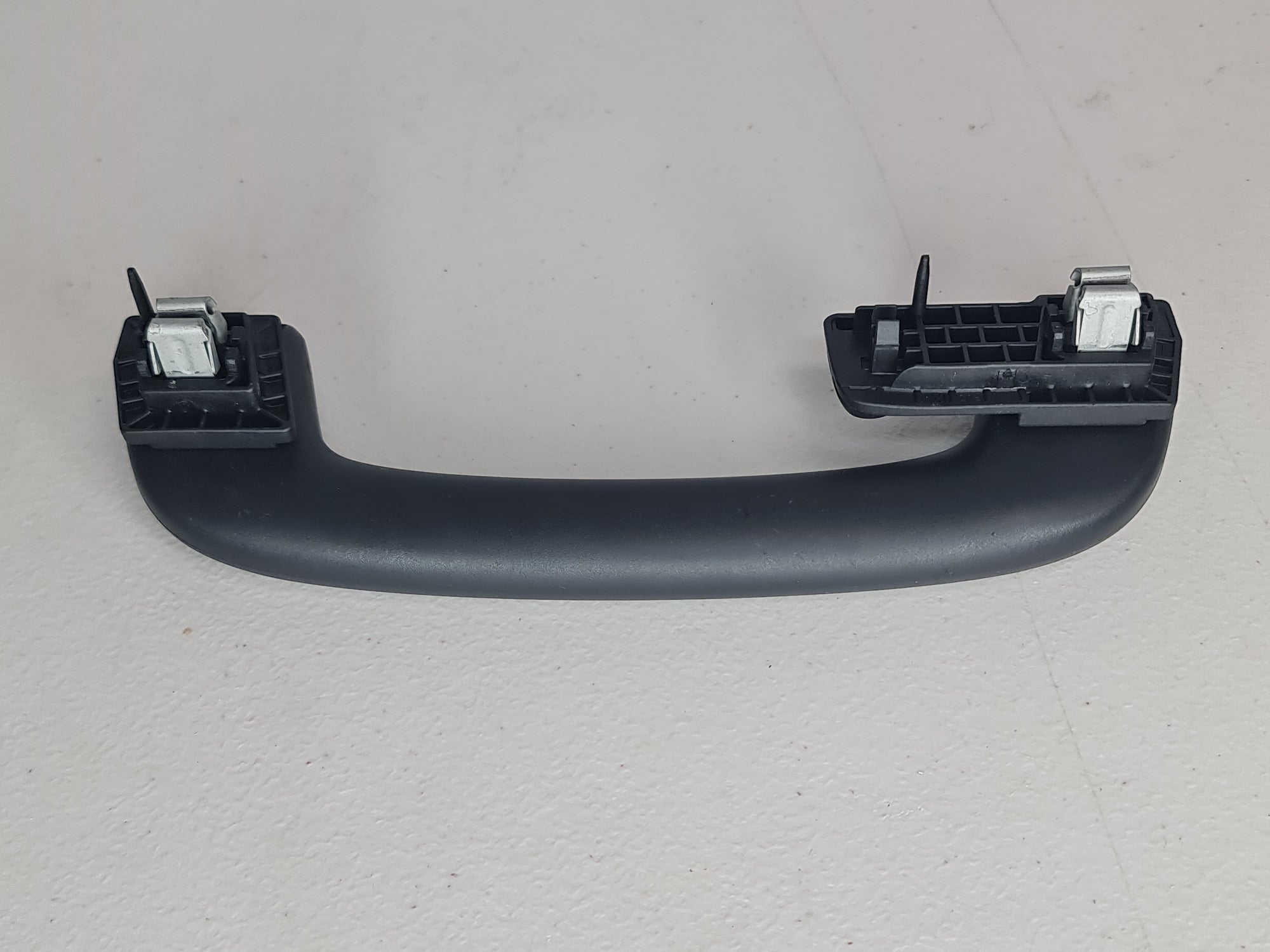 Black F80 Roof Grab Handle Arm Holder by MPerformance.parts, shown mounted inside the vehicle for easy roof access.
