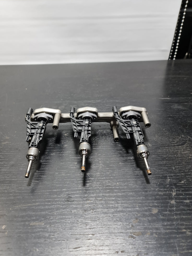 Three BMW G80 M3 fuel injectors 0261500502 for petrol engines, compatible with S58B30A engine, by MPerformance.parts.