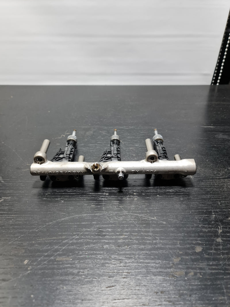 Three BMW G80 M3 fuel injectors 0261500502 for S58B30A petrol engine, displayed in the image with detailed nozzle components.