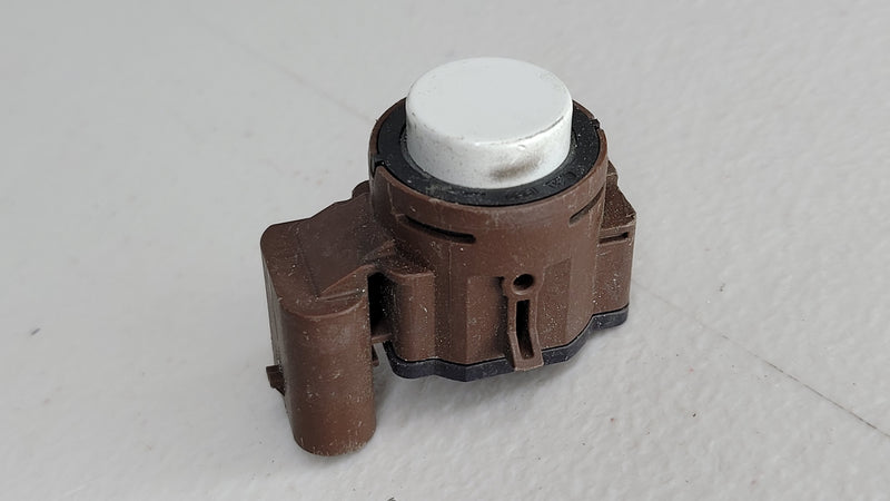 Genuine OEM BMW front outer parking aid sensor by MPerformance.parts, close-up of the sensor component with wiring.
