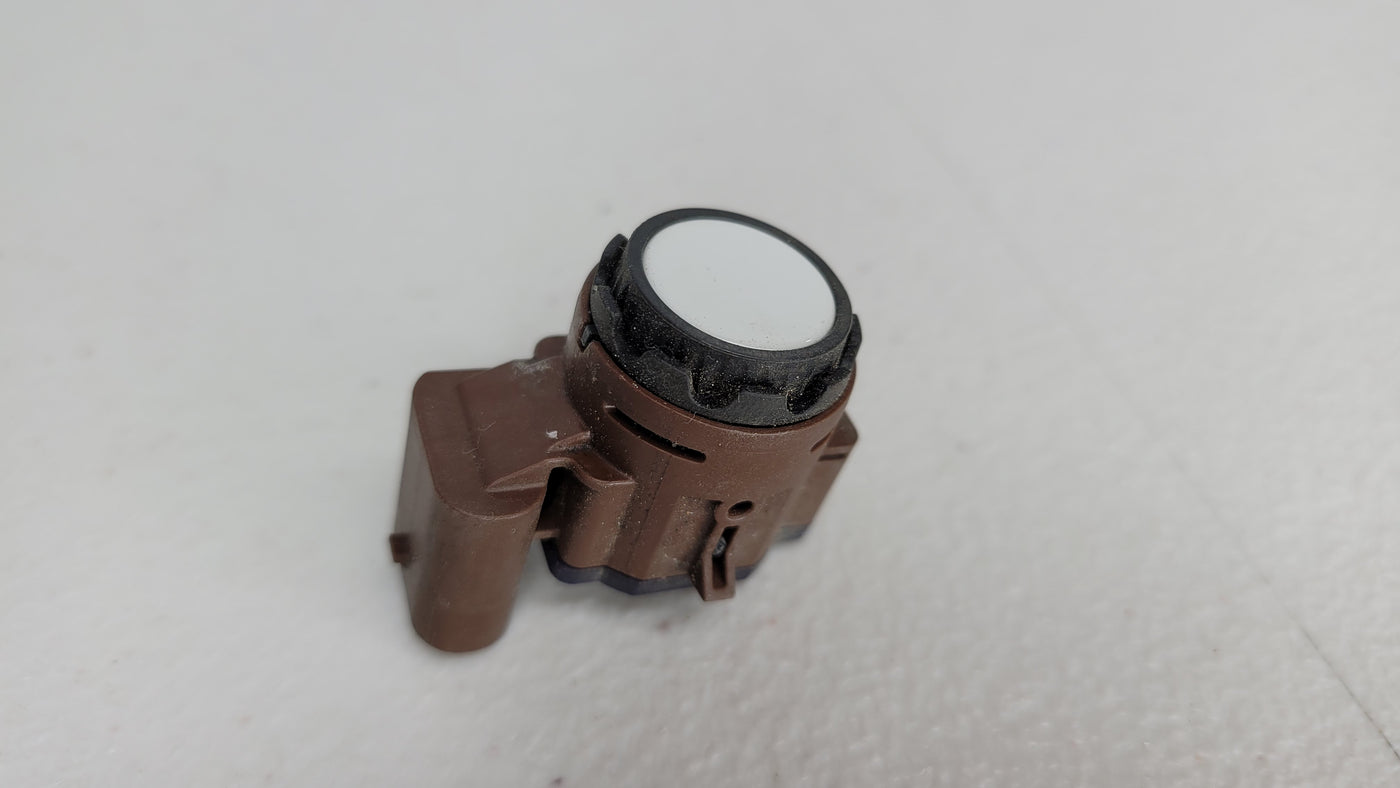 Genuine OEM BMW front outer parking aid sensor by MPerformance.parts, close-up view showing sensor details and mounting.
