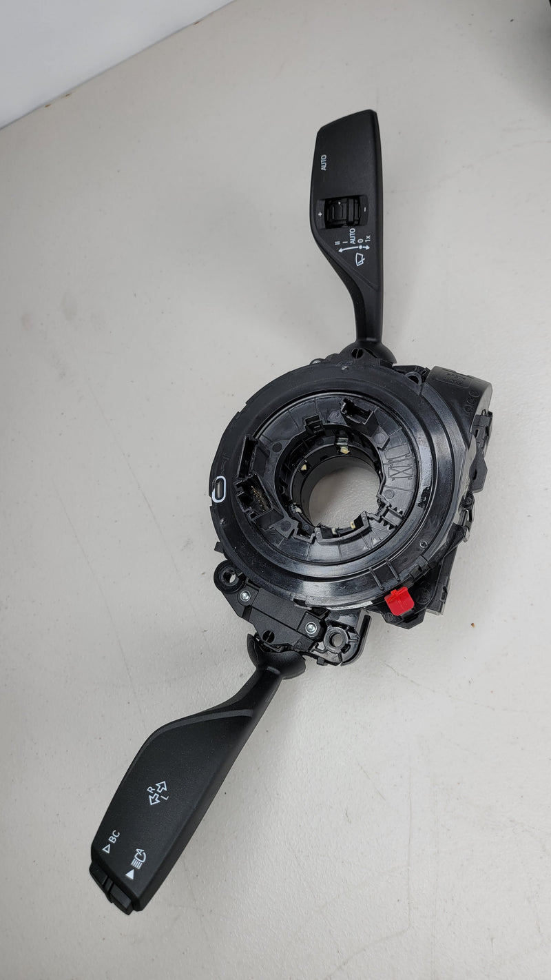 BMW 3 Series G80 M3 clock spring wiper indicator turn stalk, black plastic with electrical connectors and mounting points.