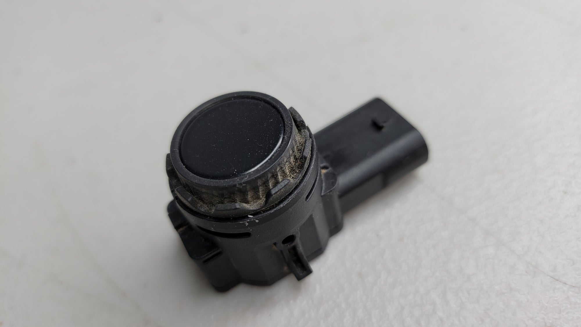BMW PDC bumper parking ultrasonic sensor by MPerformance.parts, showing the sensor component for 2, 3, 5, 7 Series, X5, X6, X7 models