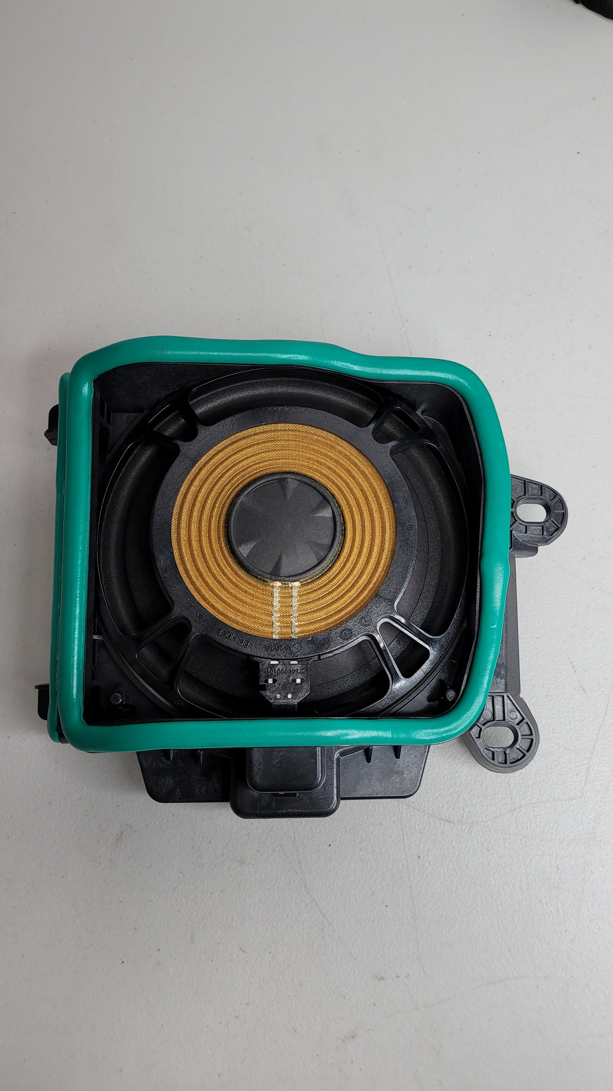 BMW M3 G80 front under seat speaker, OEM part 65132622490, black speaker with MPerformance.parts branding visible.