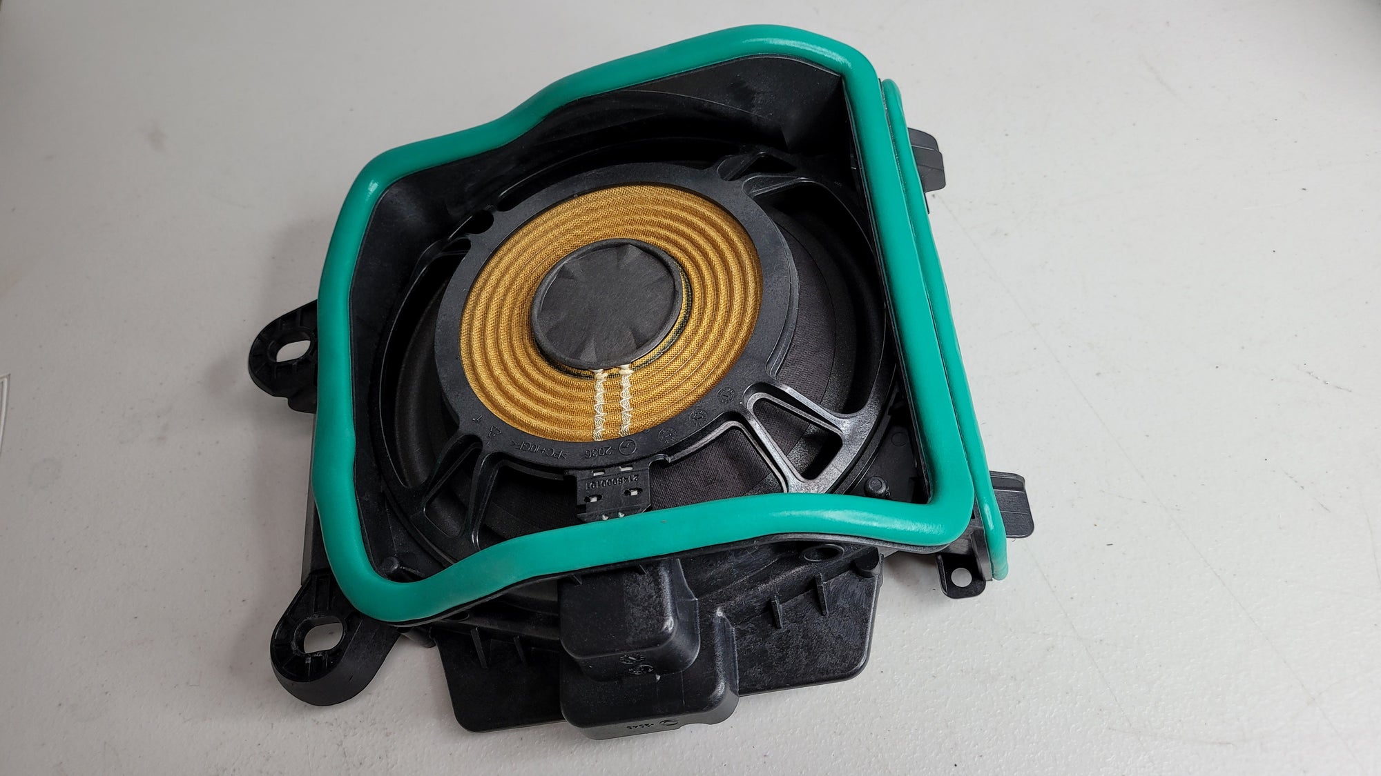 BMW M3 Competition OEM under seat speaker from MPerformance.parts, G80 model, shown installed beneath the seat.
