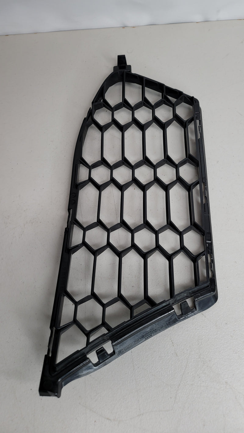 BMW M4 G82 coupe front left bumper grille by MPerformance.parts, showing the sleek black grille with mesh design.