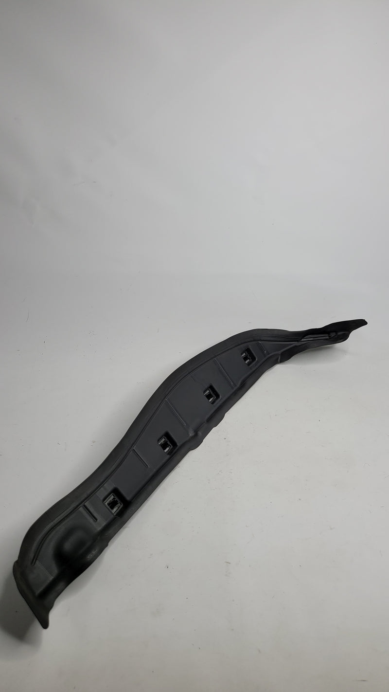 BMW M3 G80 front left inner fender door seal trim cover, part 7433819, shown on the vehicle's wheel well area.
