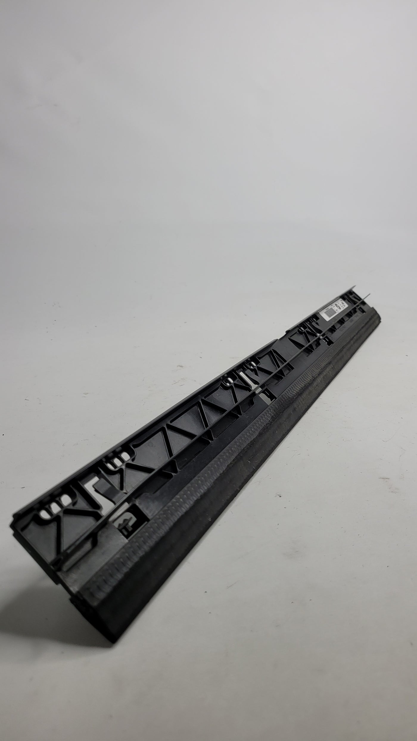 Original BMW G80 G81 G82 G83 engine oil cooler front cover strip by MPerformance.parts, showing the sleek metal component.