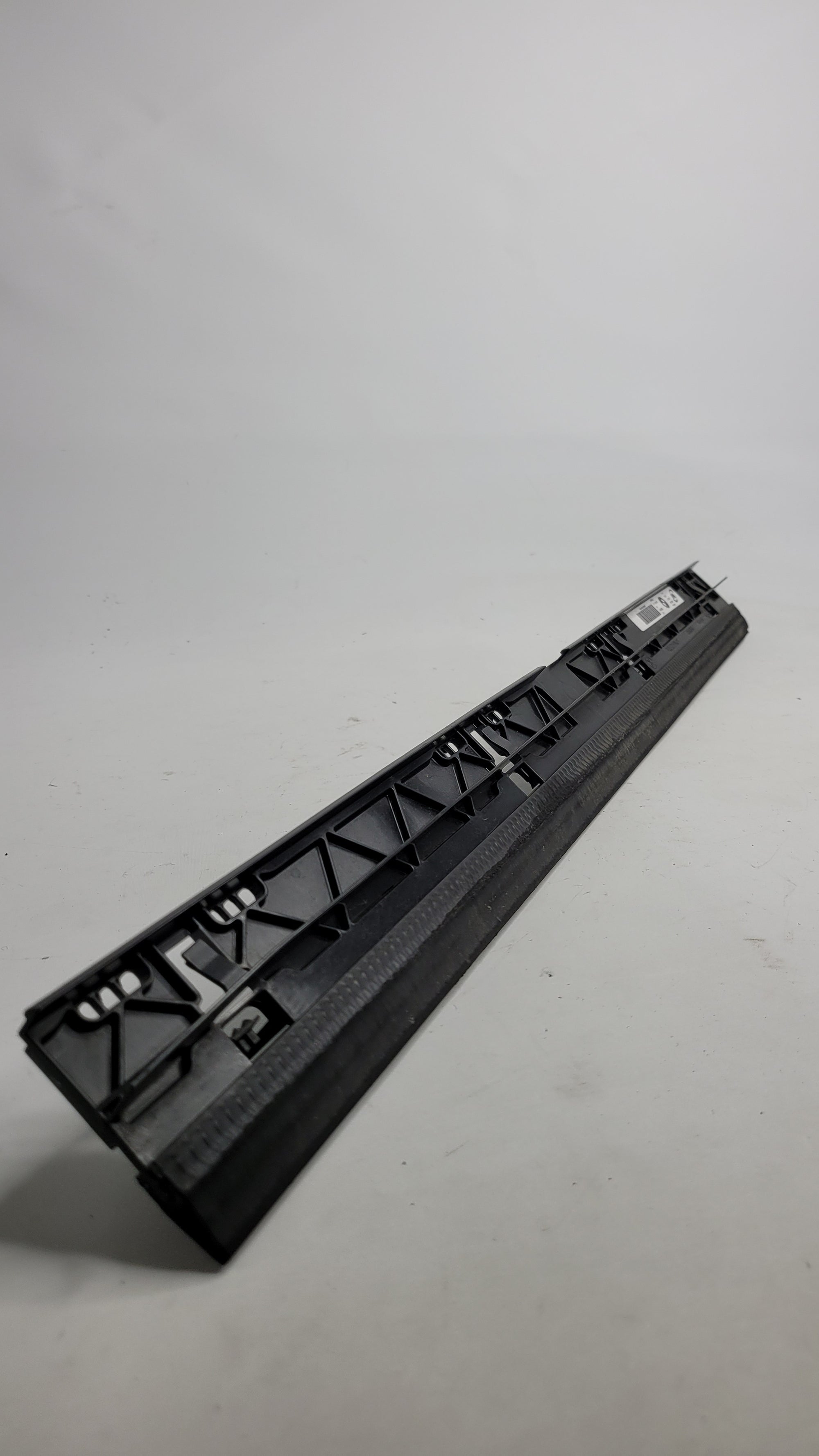 Original BMW G80 G81 G82 G83 engine oil cooler front cover strip by MPerformance.parts, showing the sleek metal component.