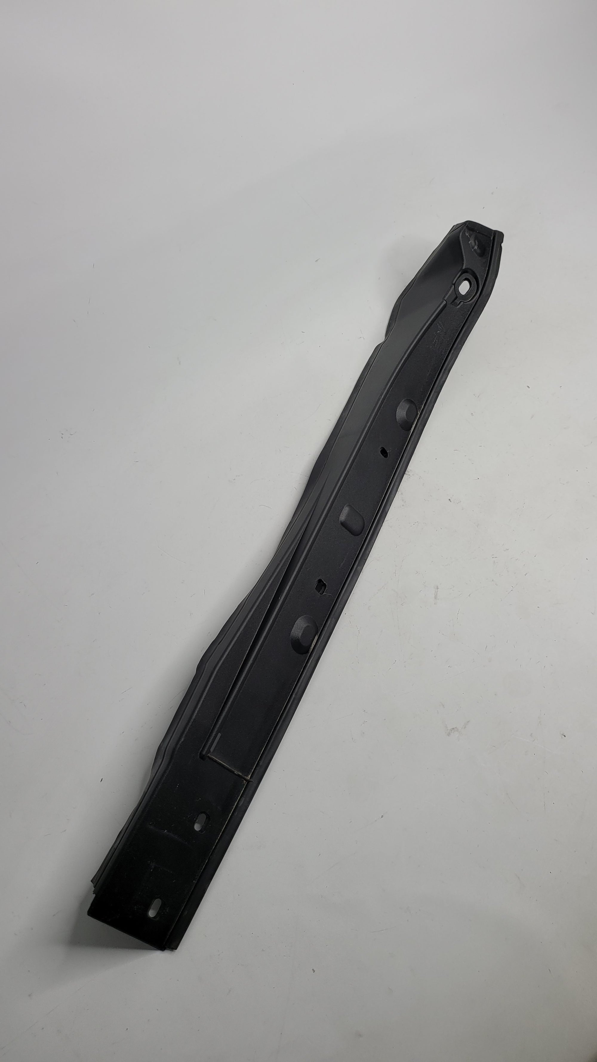OEM BMW G26 G80 left driver side under hood side frame rail cover trim molding, black plastic with mounting clips.