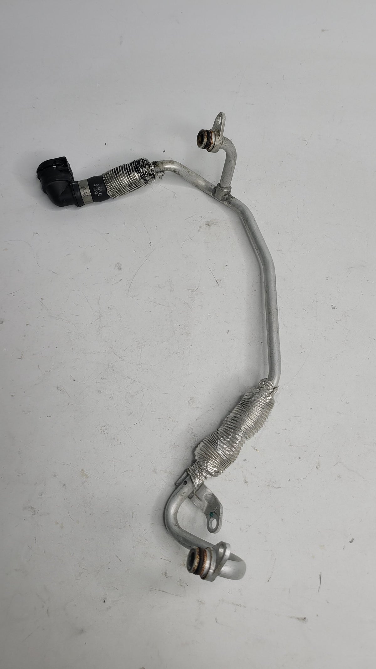 BMW MPerformance.parts product 05196-M, automotive part with visible metal and plastic components, designed for BMW vehicles.