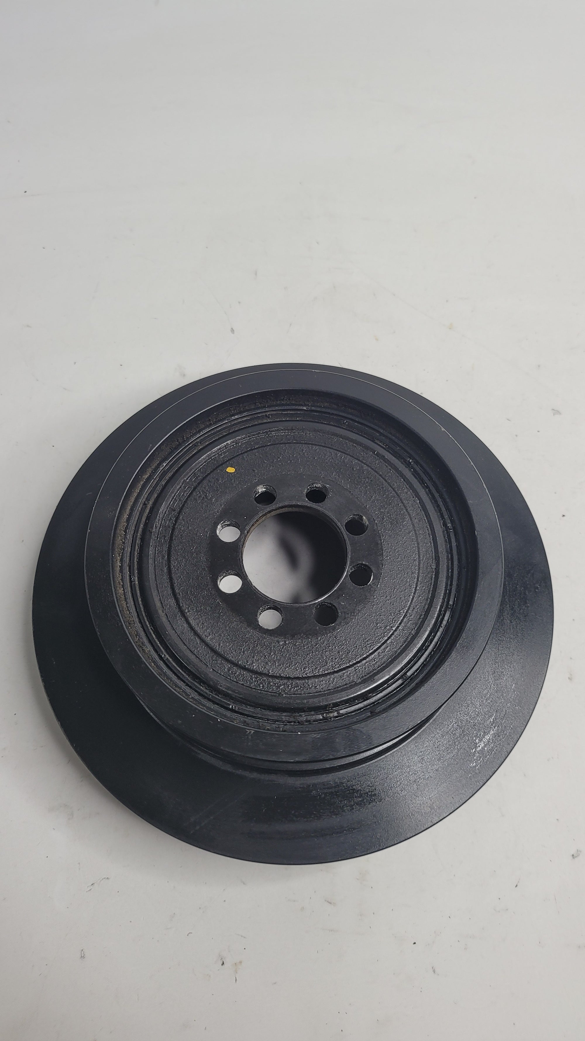 BMW F80 M3 F82 M4 S55 vibration damper crankshaft pulley by MPerformance.parts, showing the black metal pulley with mounting details.