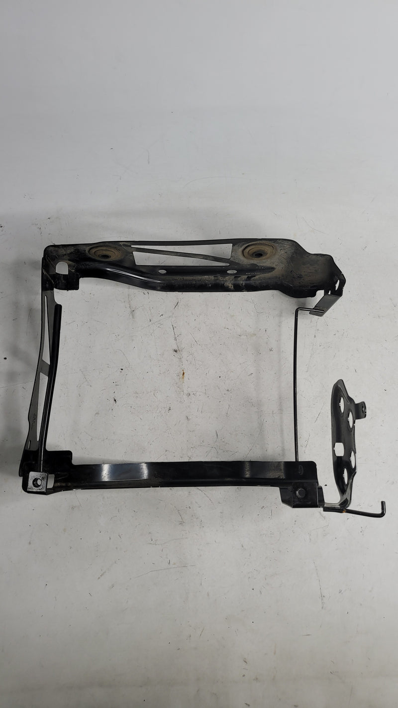 BMW M4 G82 front right radiator mount plate, part 8071636, from MPerformance.parts, shown on a silver coupe engine bay.