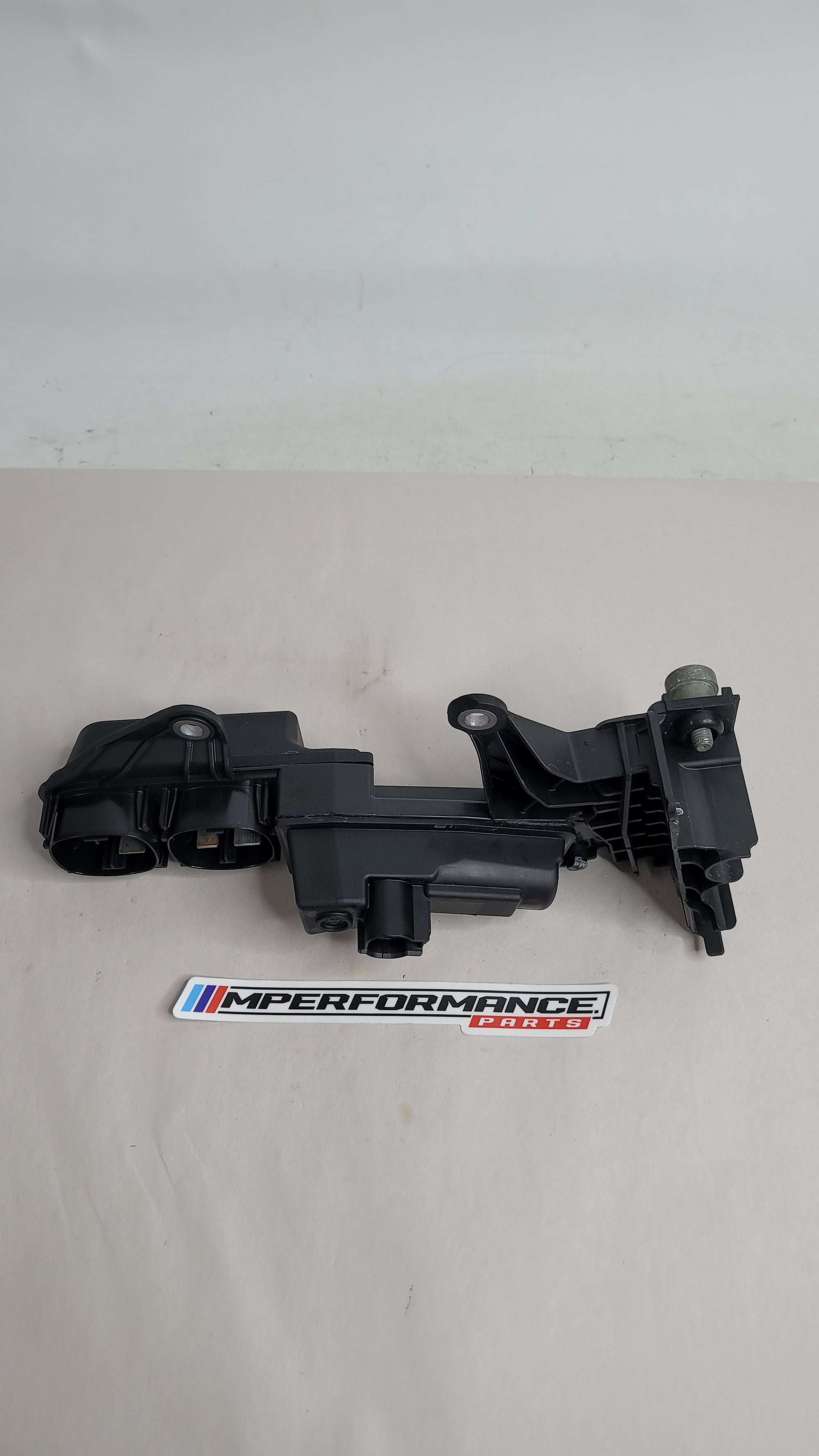 BMW 3 4 Series G20 G21 G22 G23 G26 G80 G82 fuse box jump start terminal from MPerformance.parts, showing the black plastic component.