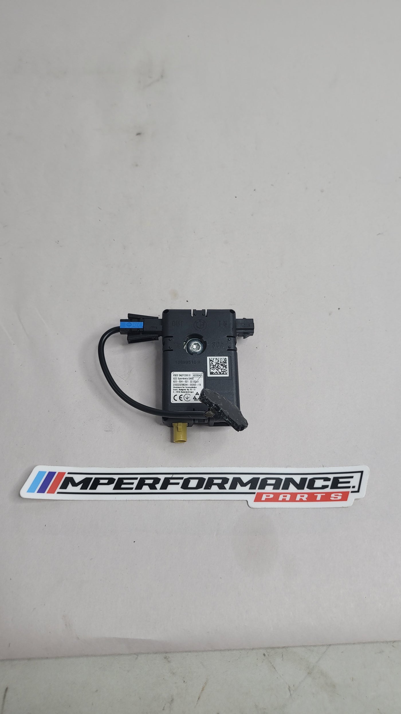 BMW 3 Series G20, G80, G28 M3 Competition antenna amplifier by MPerformance.parts showing the compact electronic device.