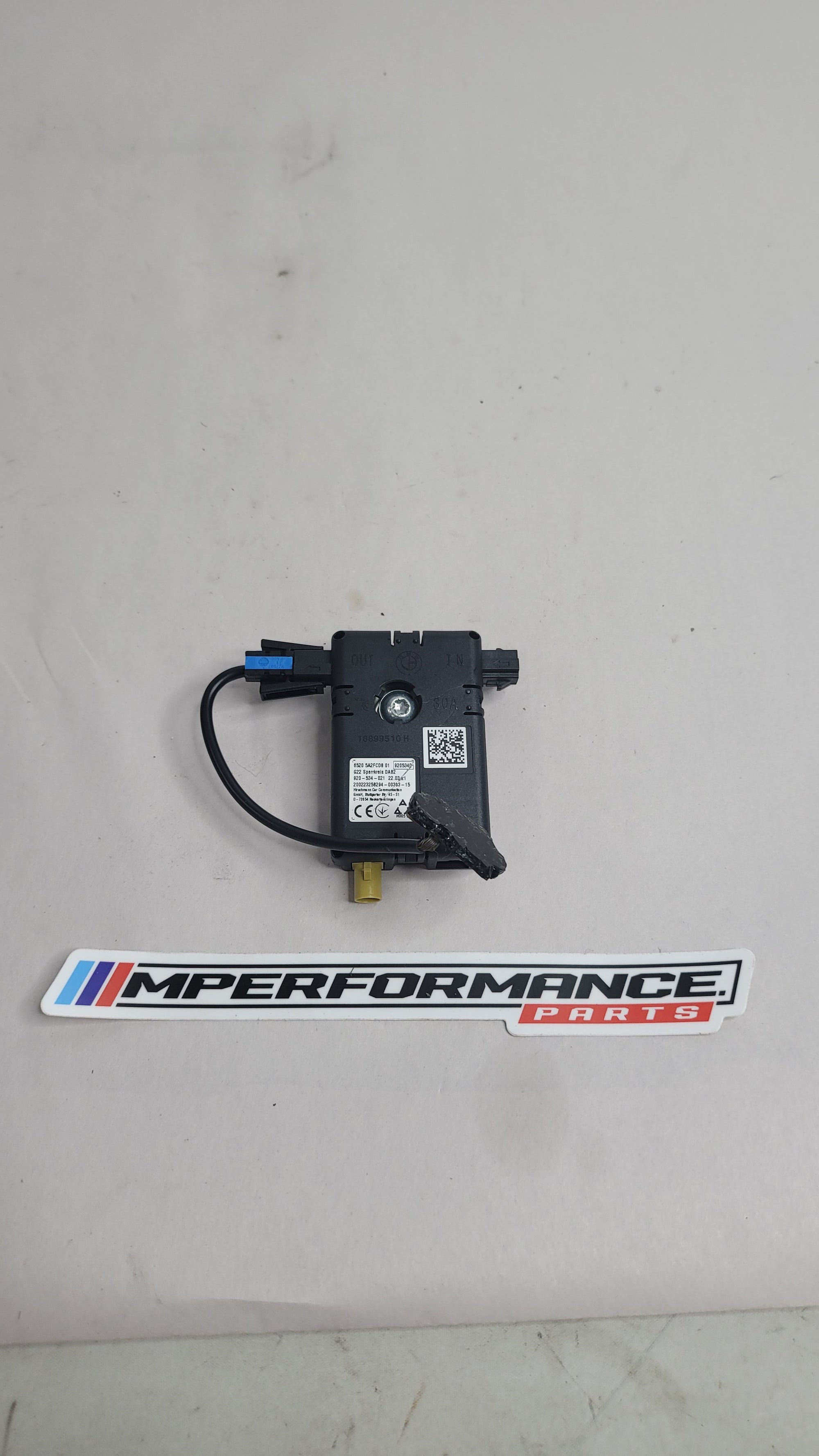 BMW 3 Series G20, G80, G28 M3 Competition antenna amplifier by MPerformance.parts showing the compact electronic device.