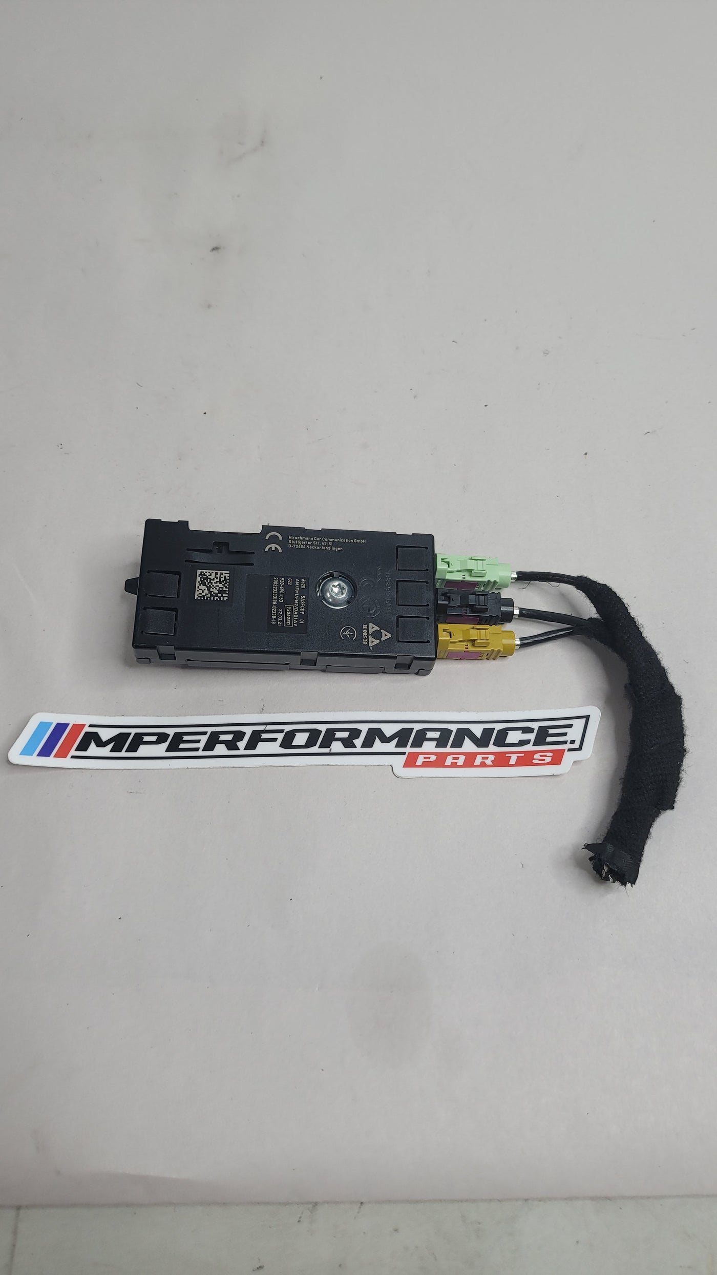 BMW 3 Series G20 G80 G28 M3 Competition antenna amplifier by MPerformance.parts, showing the compact electronic component.