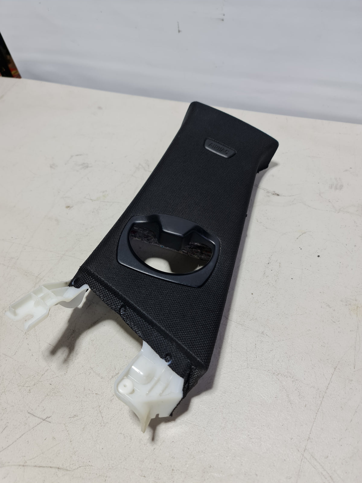 BMW 4 Series F32 right passenger center pilar trim cover, side view showing the black plastic interior trim piece.
