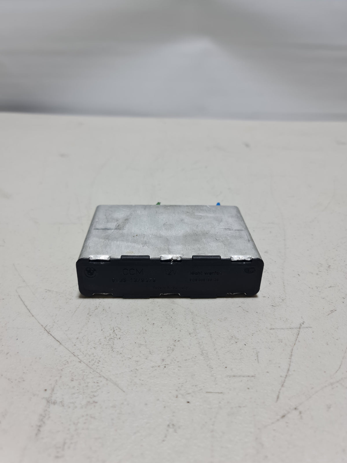 Original BMW Check Control Module 61351388614 for 5 Series and 7 Series vehicles, featuring detailed electronic controls.