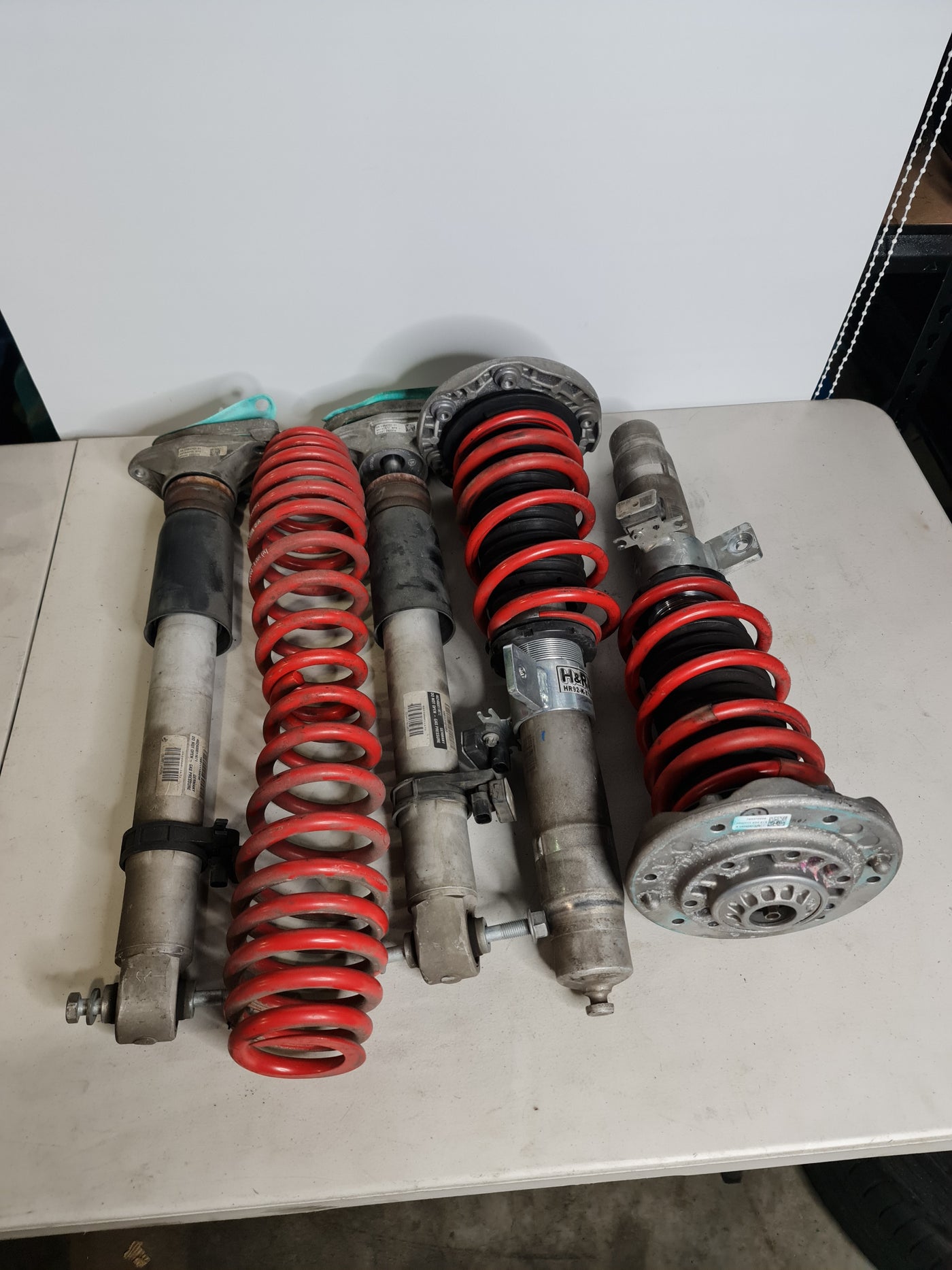BMW M2 M3 M4 F80 F82 F87 H&R Springs installed on factory EDC height-adjustable struts in a clean engine bay.