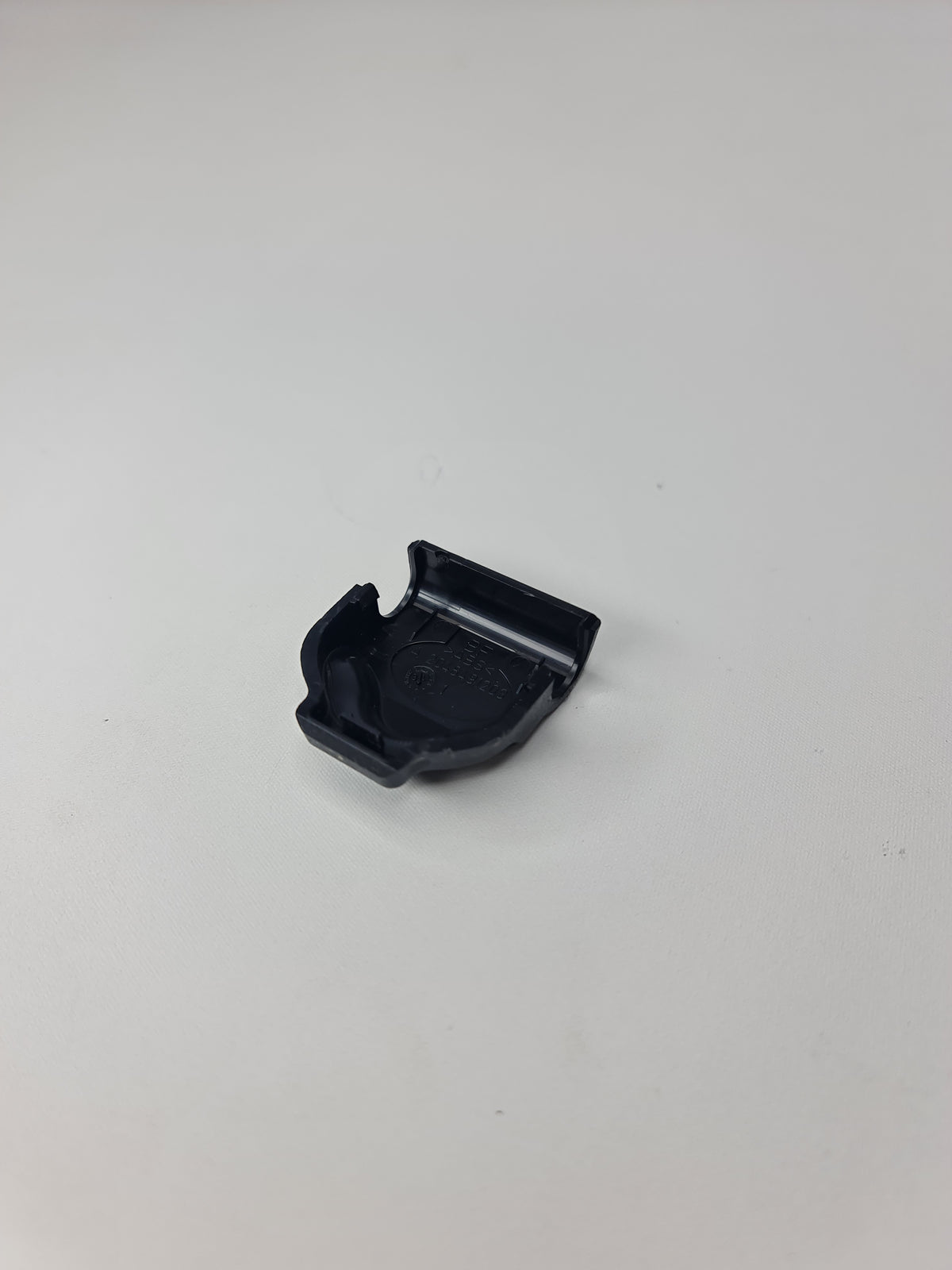 BMW fastening loop cover for 2012-2020 models, with secure loop design, part number 51477274764, compatible with various BMW vehicles.