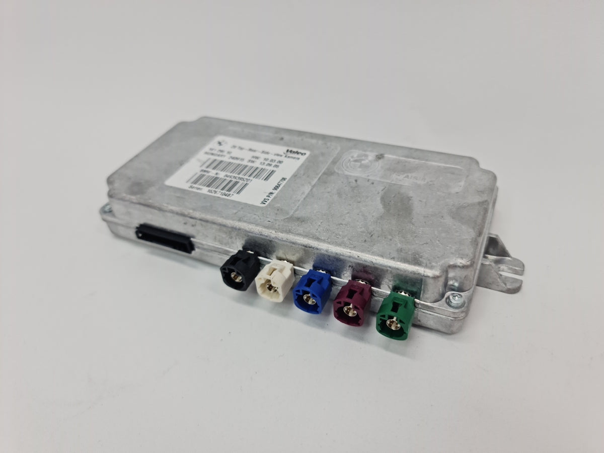 BMW M2 Series F22 ECU for top rear side view camera, showing the compact electronic control unit and wiring connections.