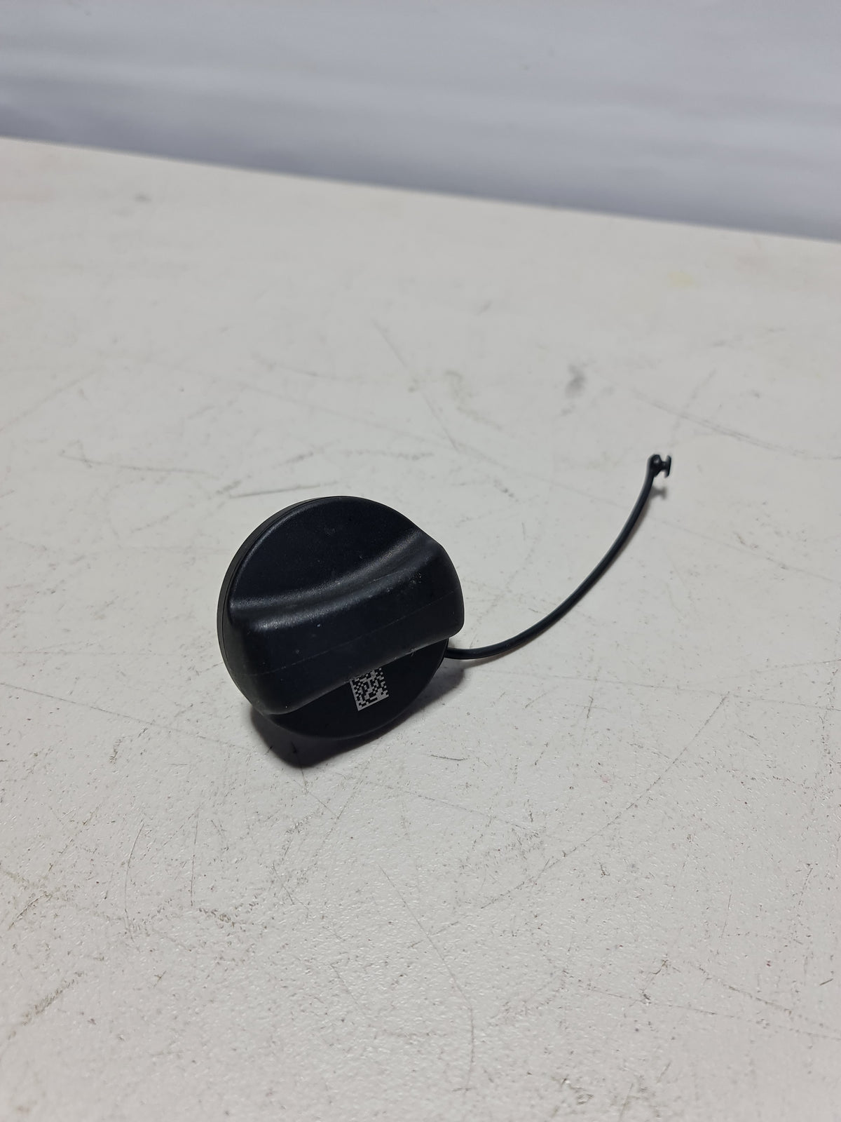 BMW filler cap for 2014-2019 models, black plastic cap with metal latch, designed for secure engine fluid sealing.