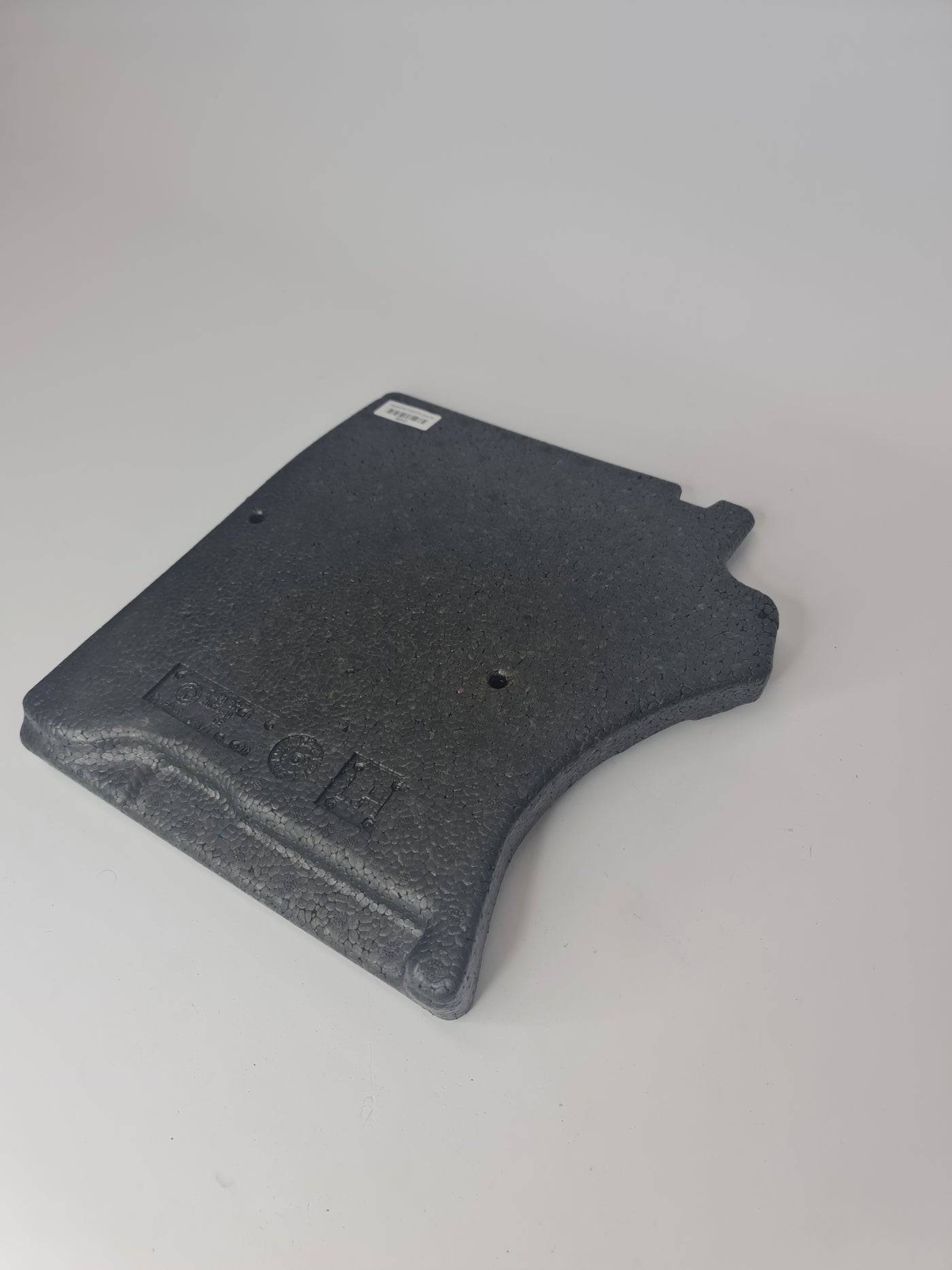 BMW foam insert footwell front left for 2012-2020 models, showing the black foam piece installed in the vehicle's footwell area.