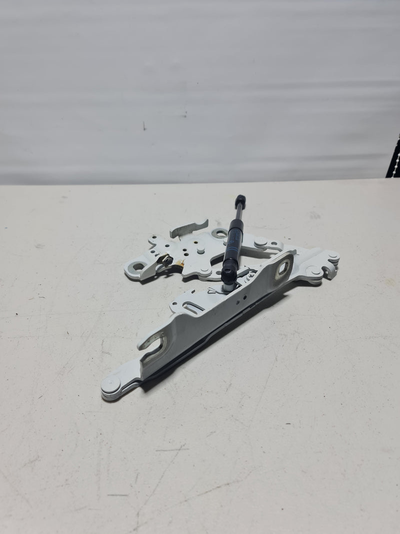 BMW F30 3 Series front left hood hinge, storm bonnet hinge, close-up of metal part with mounting points and hinge mechanism.
