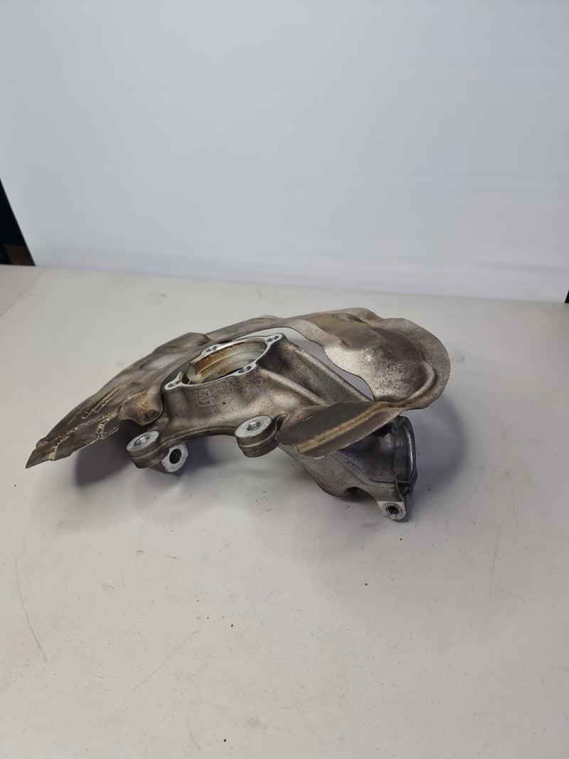 BMW front spindle knuckle hub left driver for 2015-2020 M3 M4, automotive part with part number 31212284001.