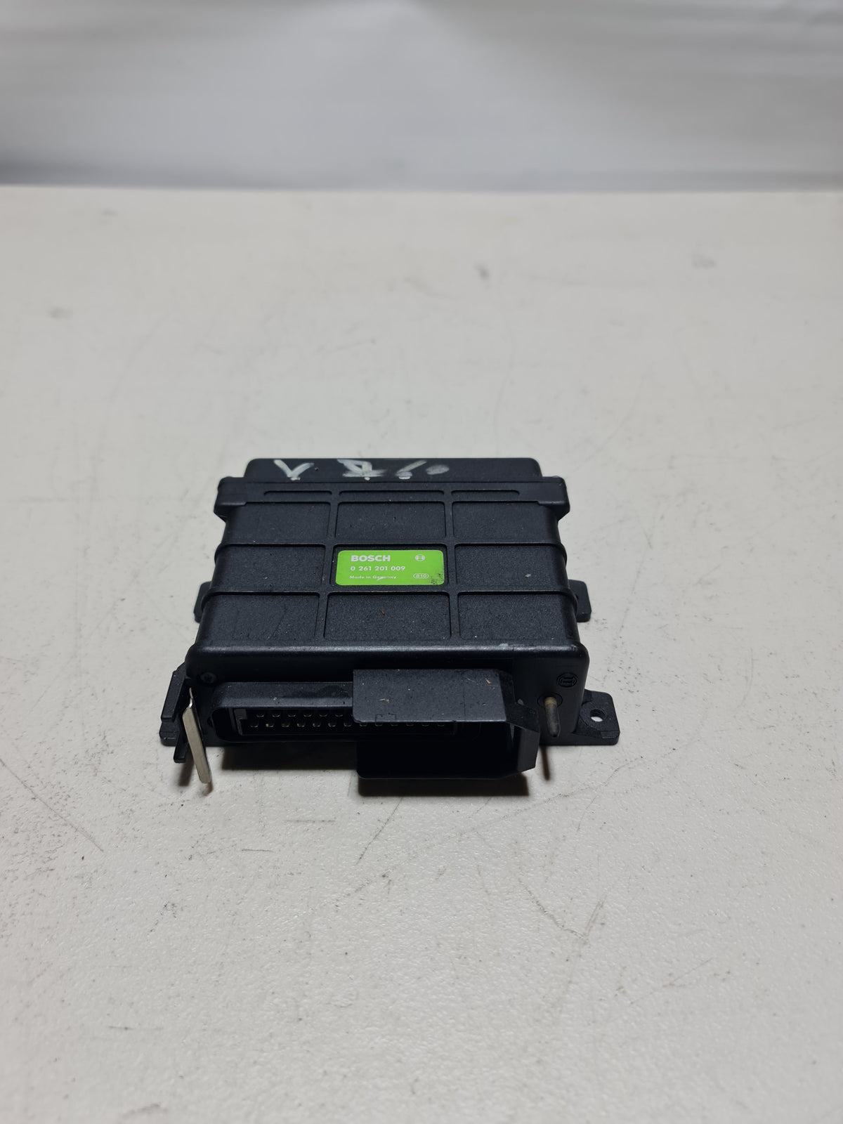 BMW genuine electric control unit ECU 0 261 201 009 OEM, showing the compact black automotive electronic module with connectors.
