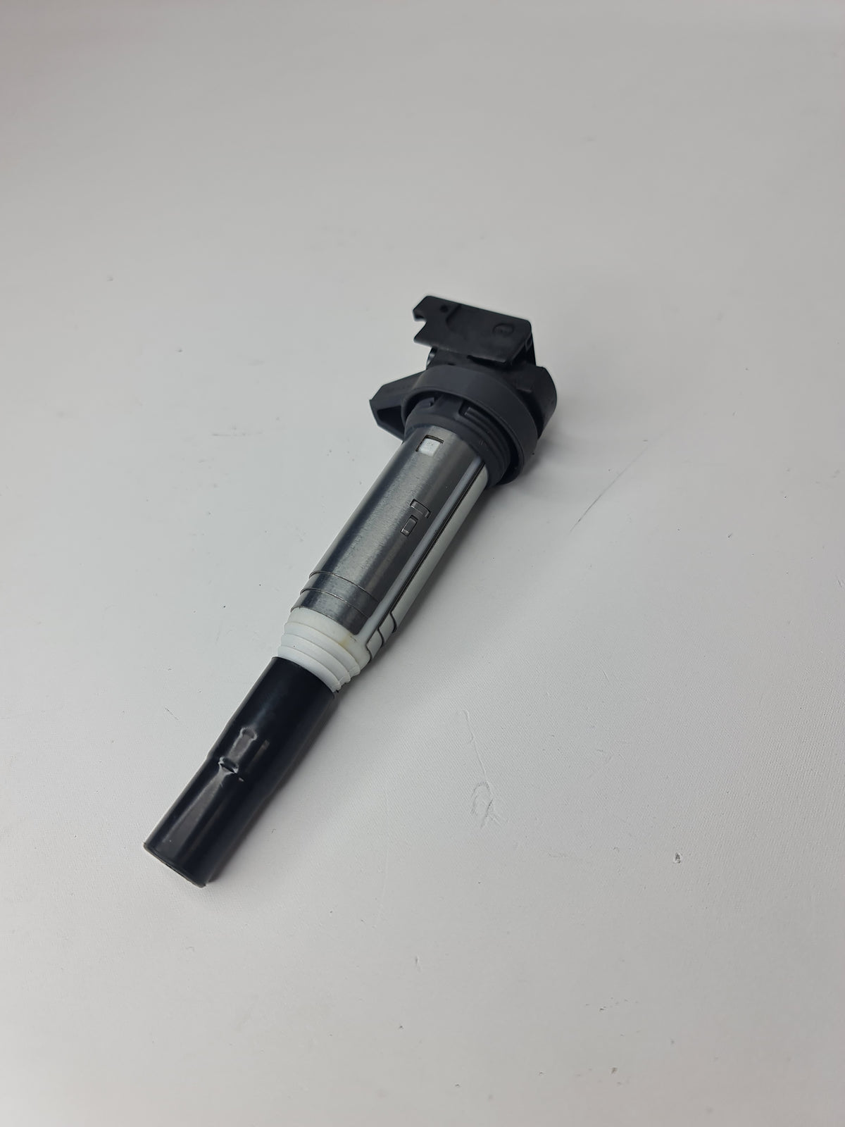 BMW ignition coil for 2001-2020 models, part number 12-13-8-616-153, showing the black cylindrical coil with electrical connectors.
