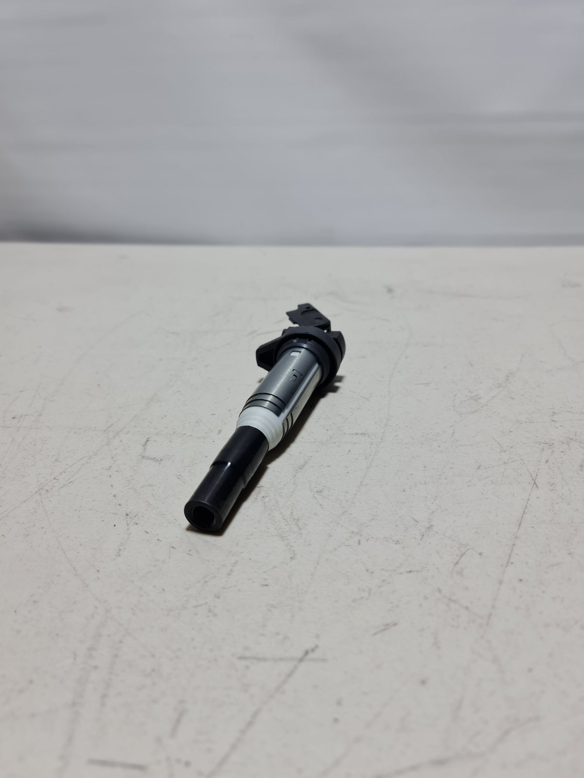 BMW ignition coil Delphi for 2001-2020 models, with black plastic body and electrical connectors, designed for engine ignition system.