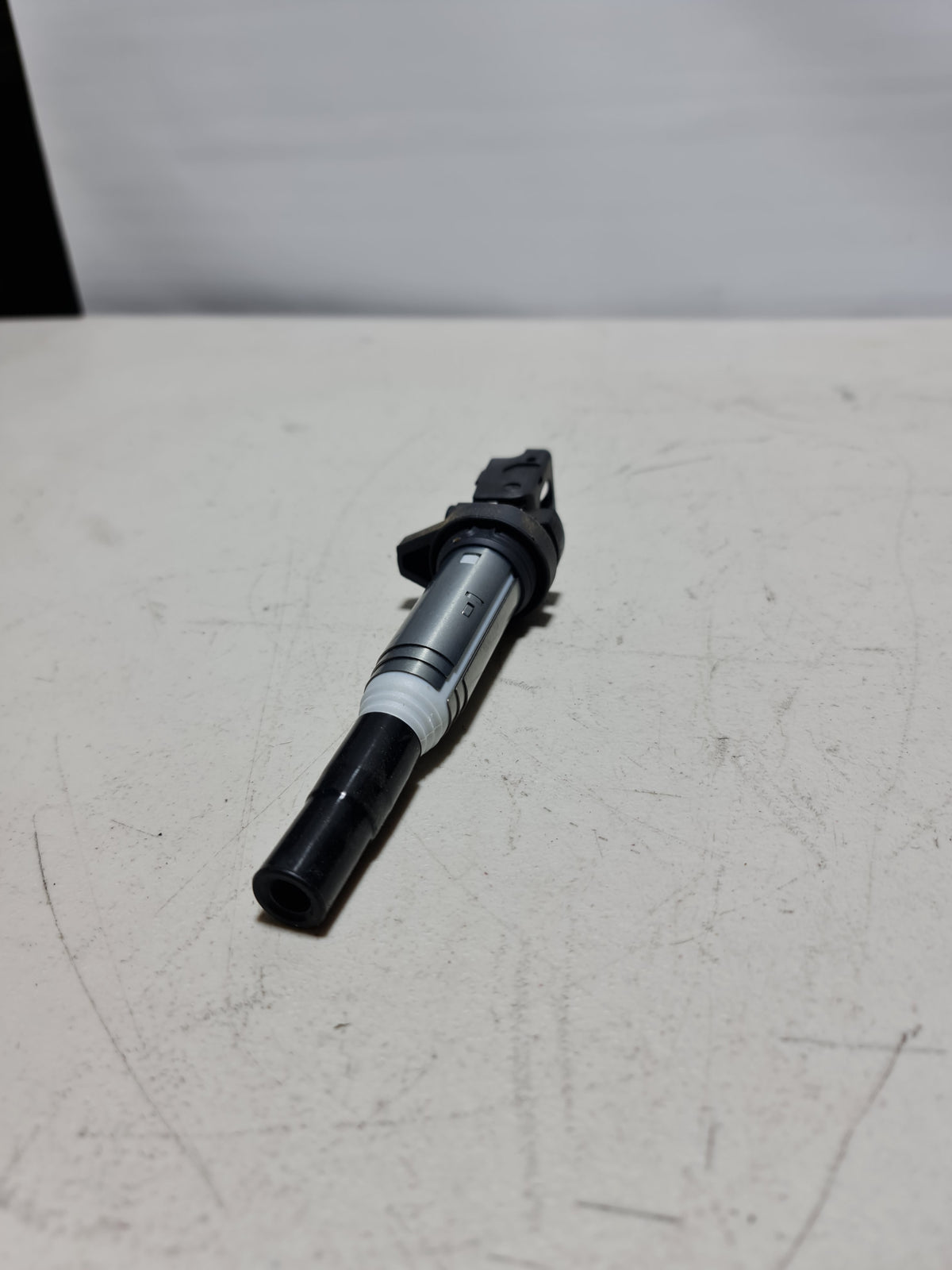 BMW ignition coil Delphi for 2001-2020 models, showing the black coil with electrical connectors and mounting base.