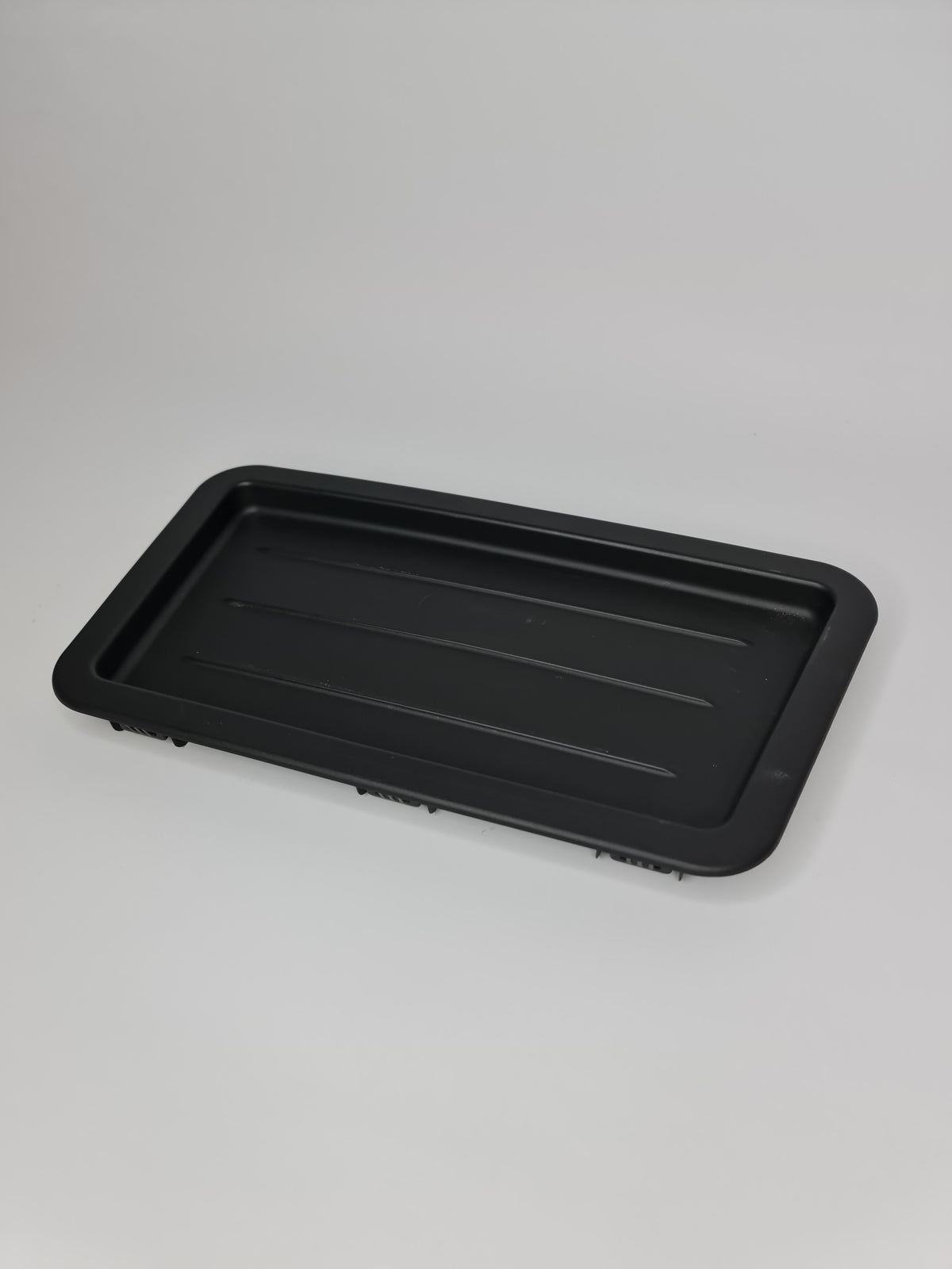 BMW 2012-2020 interior rear left storage tray, flat design, compatible with BMW models, made of durable material.