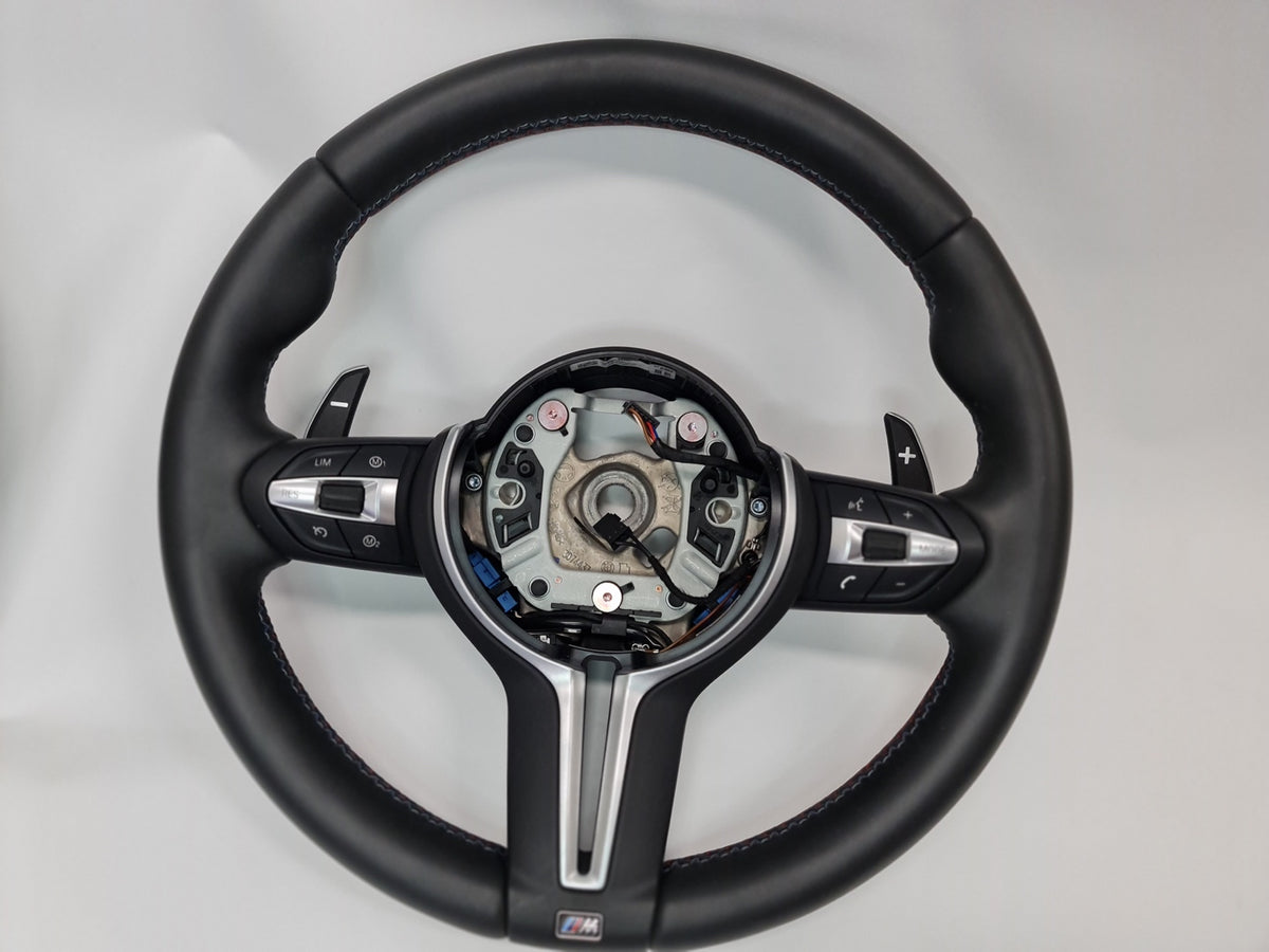 BMW M Sports steering wheel leather for M2, M3, and M4 models, showcasing premium black leather with detailed stitching.